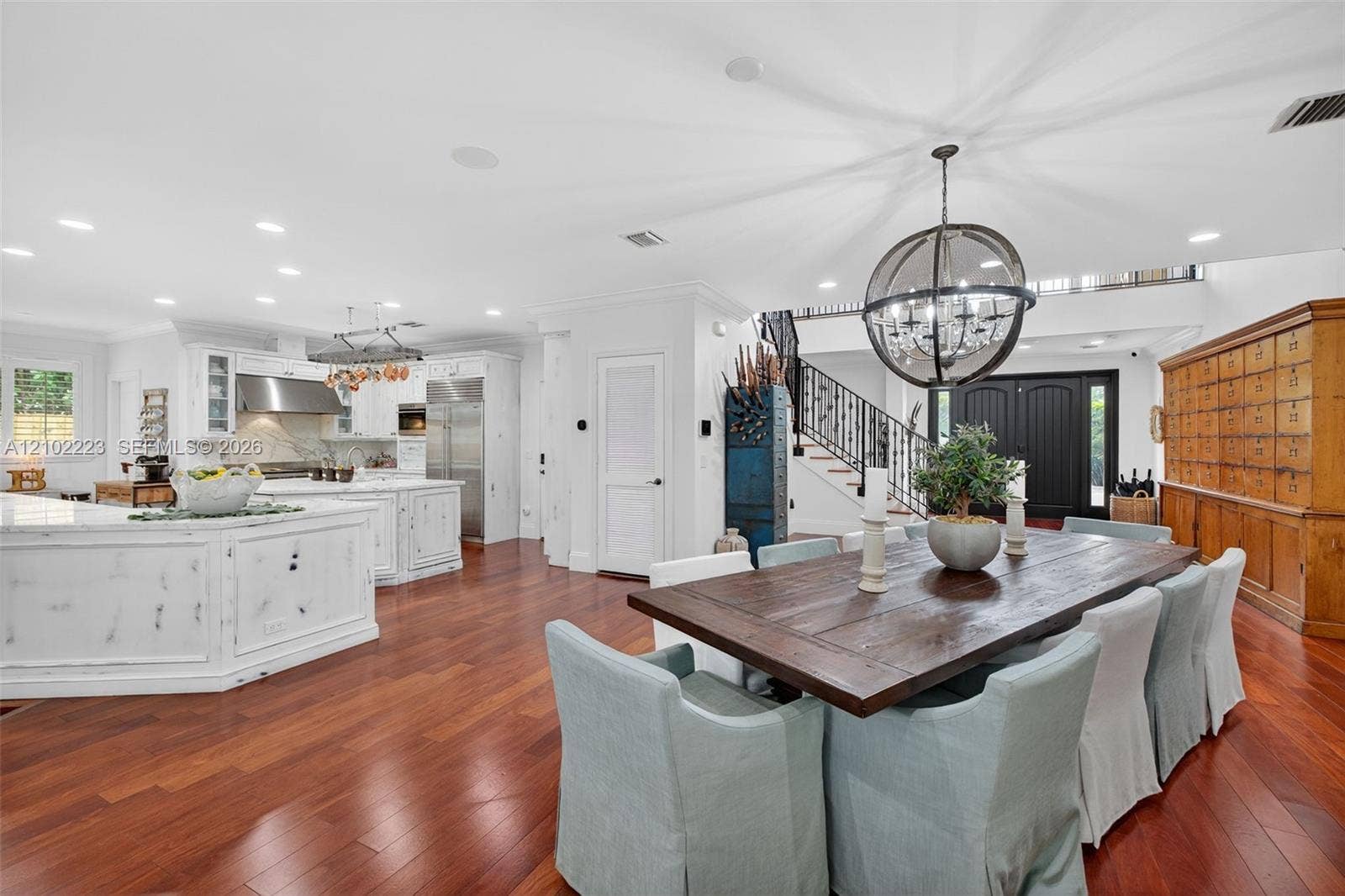 An impressive open concept, dining area offers ample space for a grand dining table, perfect for hosting elegant dinner parties, holiday celebrations and memorable, gatherings beautifully connected to the chefs kitchen. This expansive space makes entertaining effortless while maintaining a warm inviting atmosphere.