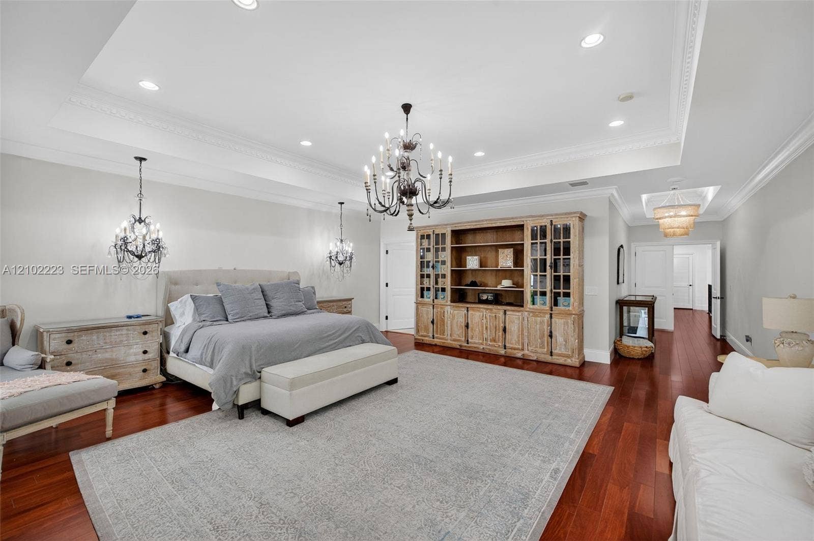 Another perspective of this extraordinary primary suite reveals its remarkable scale and versatility with room for a king size bed, a substantial sitting area and additional furnishings without compromising. Its spaciousness. This is a true owners retreat where luxury is measured in both comfort and space.
