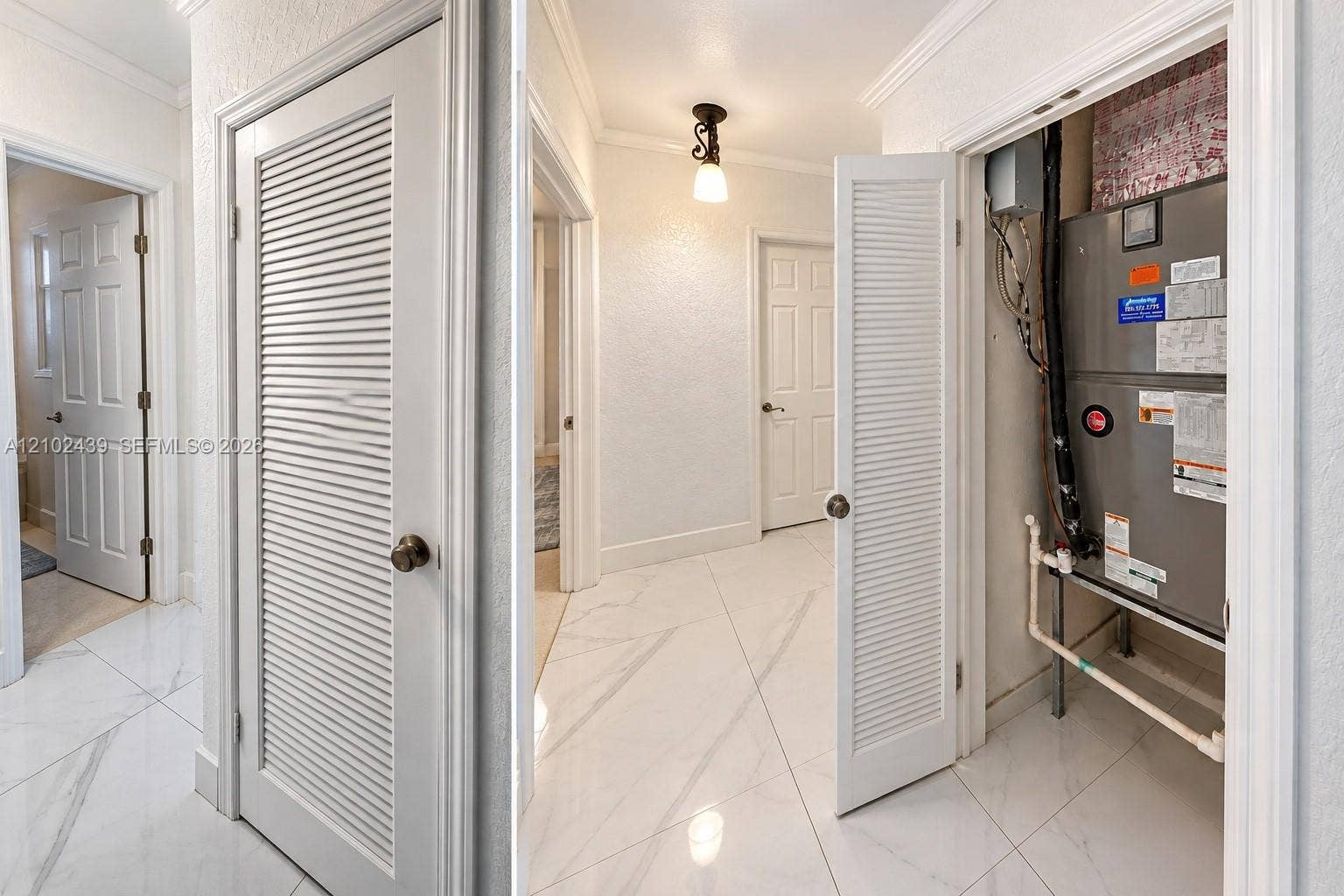White louvered utility closet door with brass-finish hardware, housing a built-in furnace unit