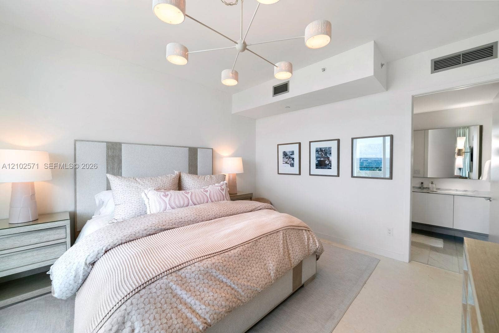 10201 Collins Avenue, #502, Bal Harbour, FL 33154 Modern chandelier with multiple drum shades, recessed ceiling lighting, and crisp neutral wall finishes