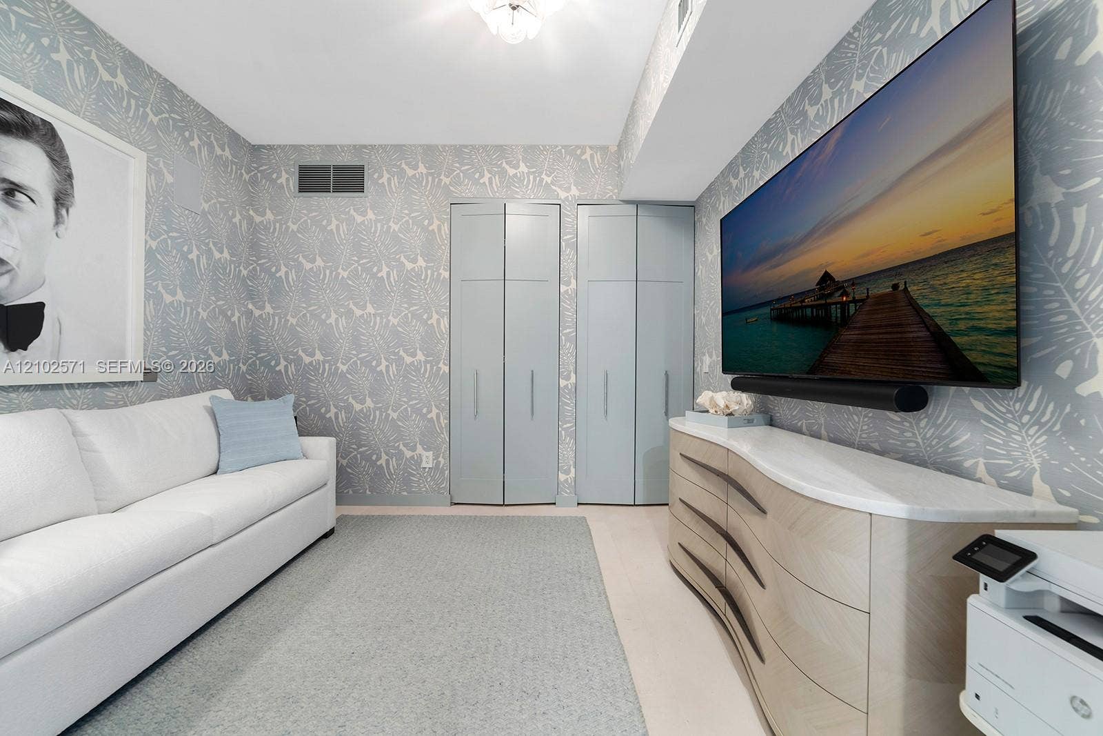 10201 Collins Avenue, #502, Bal Harbour, FL 33154 Room featuring patterned wallcoverings, dual floor-to-ceiling closets with flat-panel doors, and recessed ceiling lighting