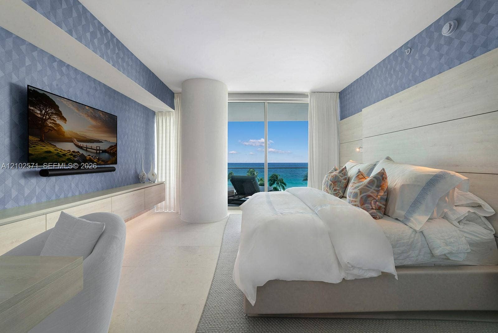 10201 Collins Avenue, #502, Bal Harbour, FL 33154 Floor-to-ceiling sliding glass doors, built-in light-tone cabinetry, geometric patterned wall covering, horizontal wood-panel wall feature, and natural stone flooring