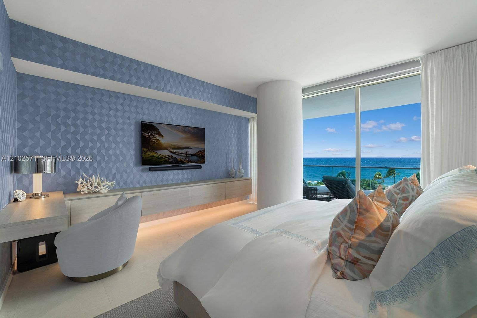 10201 Collins Avenue, #502, Bal Harbour, FL 33154 Floor-to-ceiling windows, textured accent wall, built-in cabinetry, and tile flooring