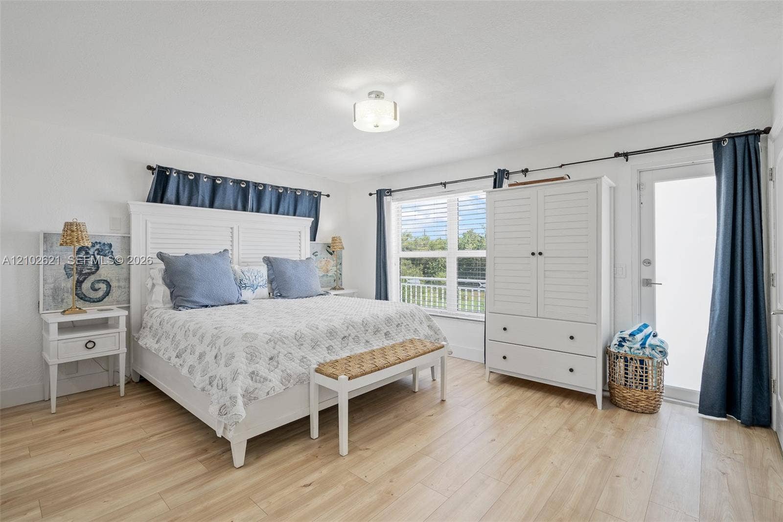 Recessed lighting, wood-finish flooring, and a glass-paned exterior door