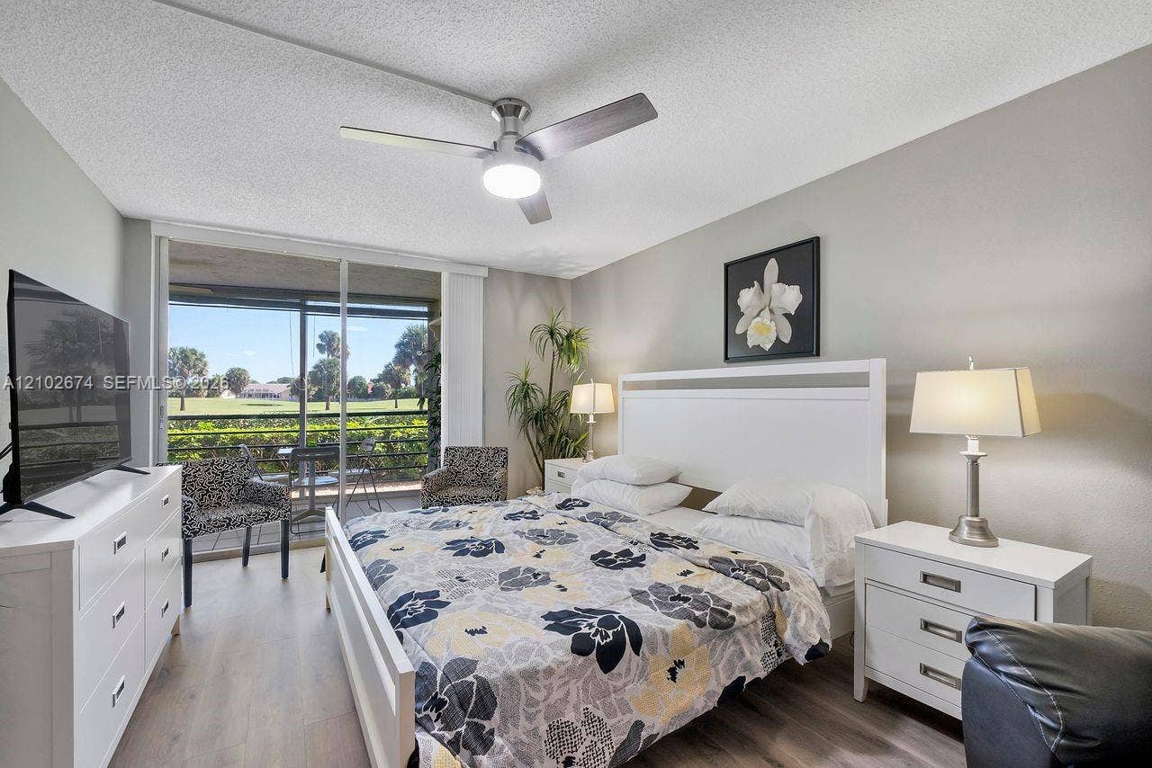 23249 N Barwood Lane N, #102, Boca Raton, FL 33428 Primary bedroom with a golf course view