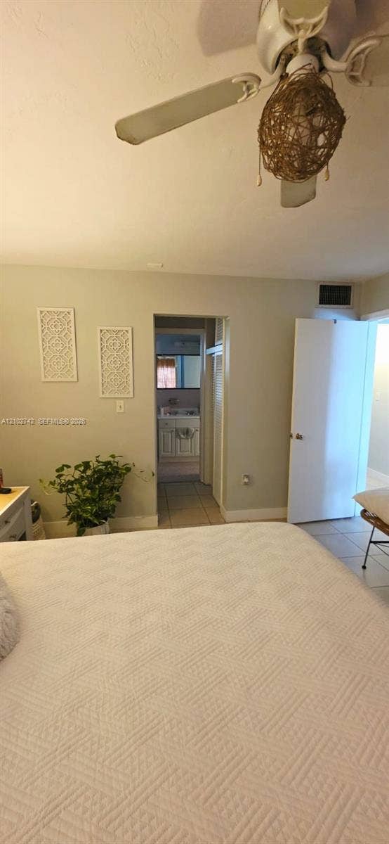 2800 NE 203rd Street, #8, Aventura, FL 33180 Ceiling-mounted fan with integrated lighting and neutral wall paint