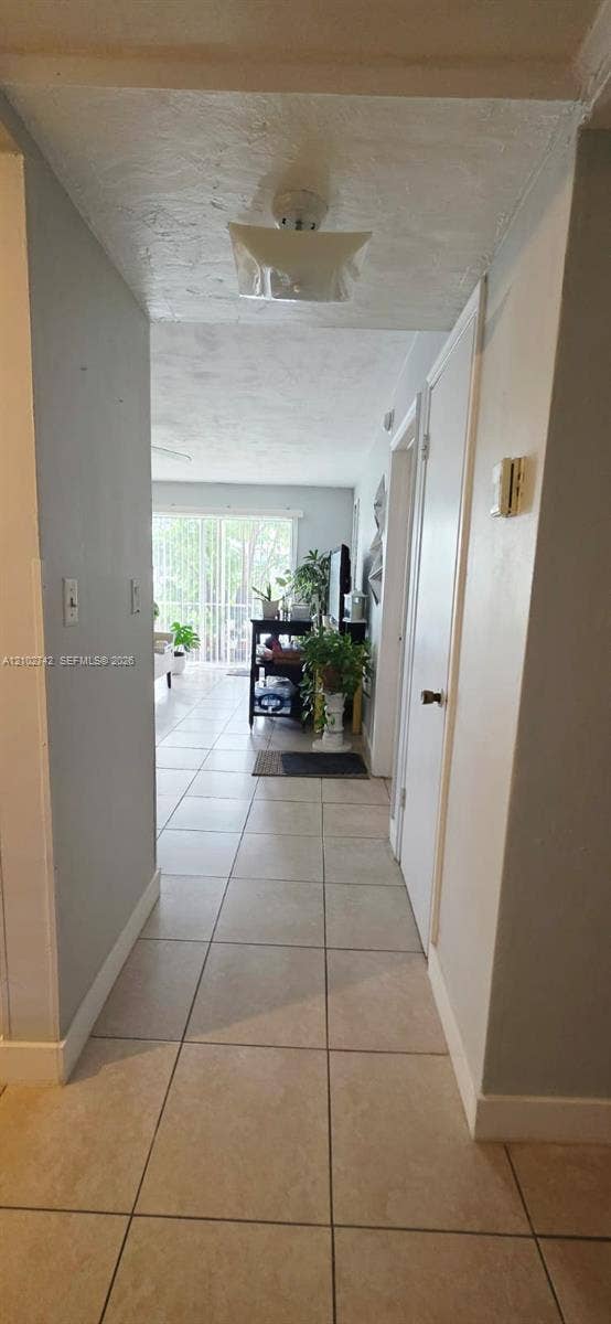2800 NE 203rd Street, #8, Aventura, FL 33180 Ceramic tile flooring, neutral wall tones, flush-mount ceiling light fixture, and interior doors