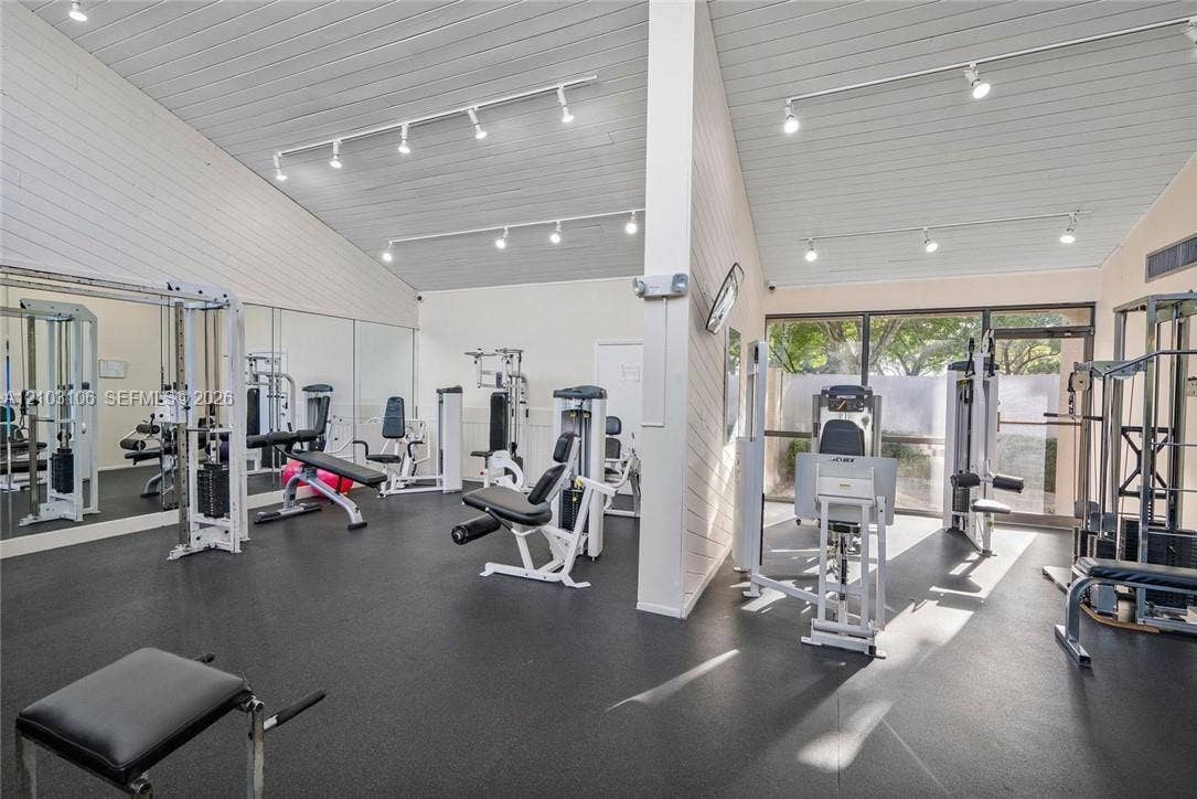 2230 N Cypress Bend Drive, #308, Pompano Beach, Pompano Beach, FL 33069 Vaulted ceilings with exposed beams, track lighting, full-wall mirrors, and durable flooring