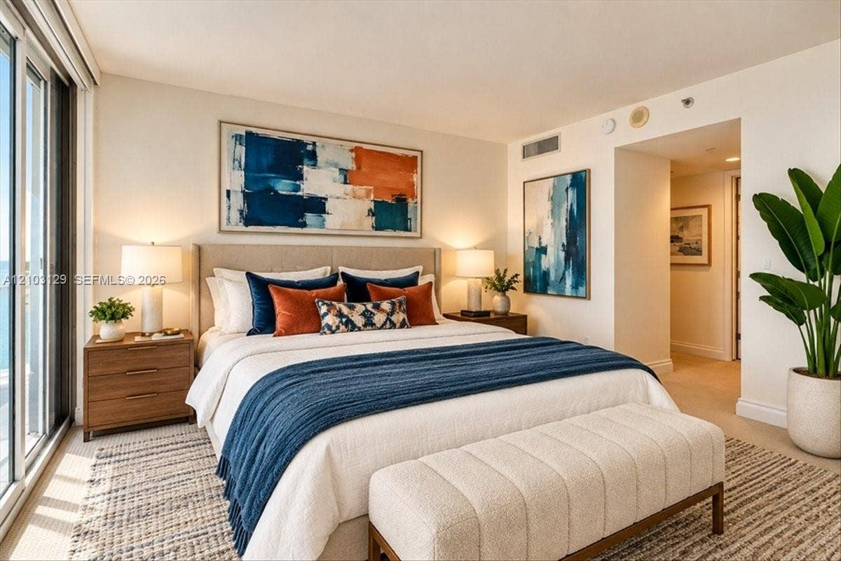 1627 Brickell Avenue, #2005, Miami, FL 33129 Neutral-toned walls, wall-to-wall carpeting, and floor-to-ceiling glass sliding doors
