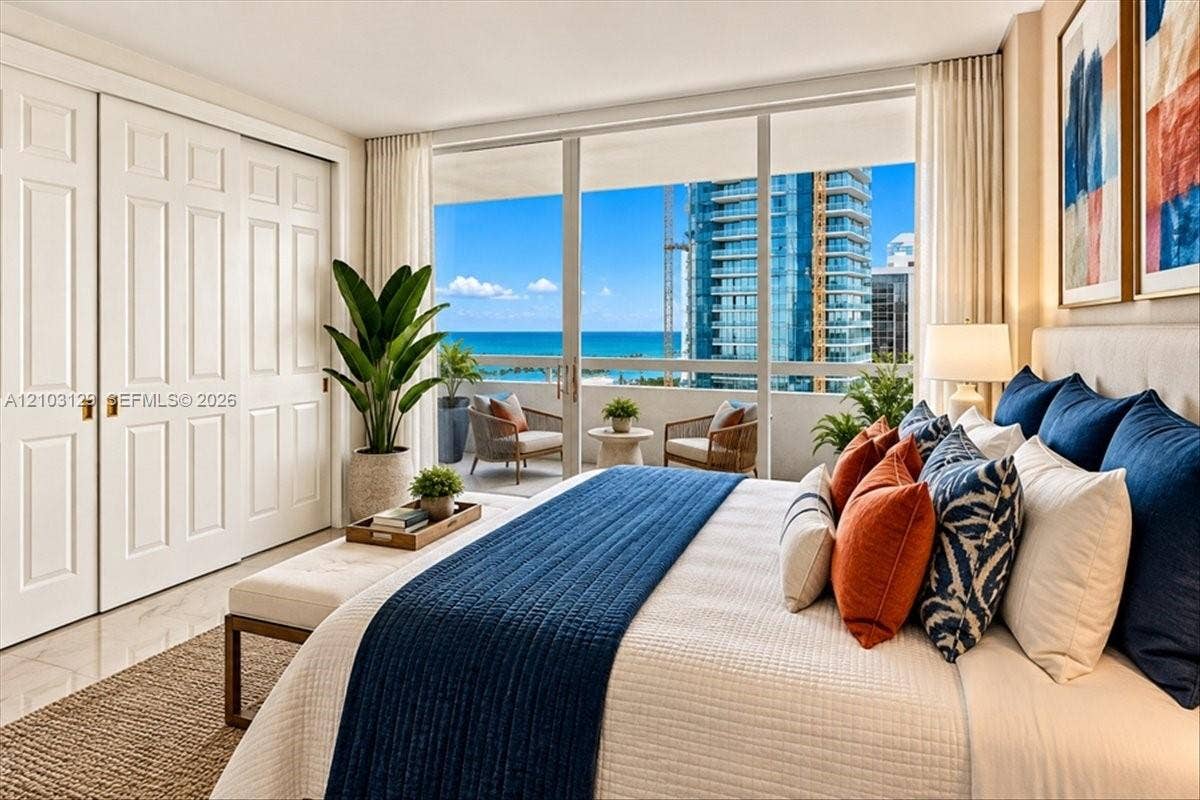 1627 Brickell Avenue, #2005, Miami, FL 33129 Floor-to-ceiling glass sliding doors opening to a private balcony, polished tile flooring, and integrated panel-door closets