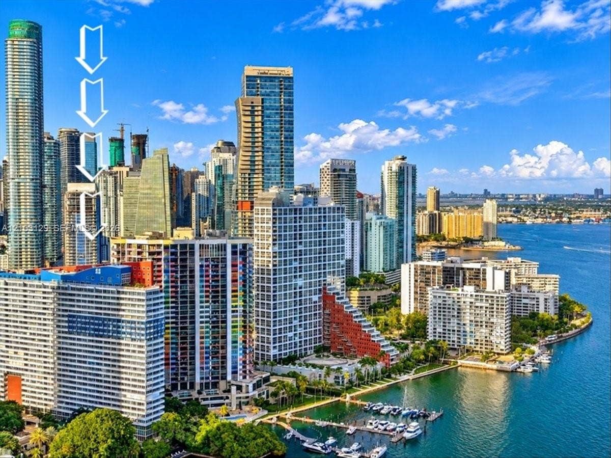 1627 Brickell Avenue, #2005, Miami, FL 33129 High-rise urban building featuring expansive cityscape surroundings and coastal proximity to the bay