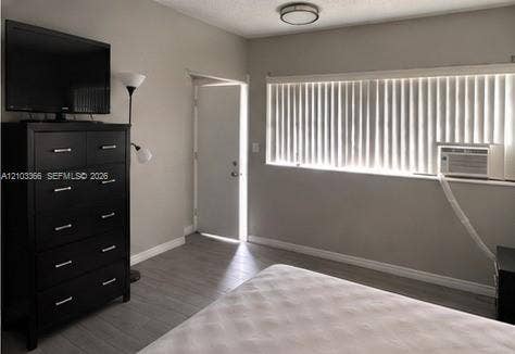26 Diplomat Parkway, #2342, Hallandale Beach, FL 33009 Neutral wall finishes, wood-finish flooring, and a flush-mount ceiling light fixture