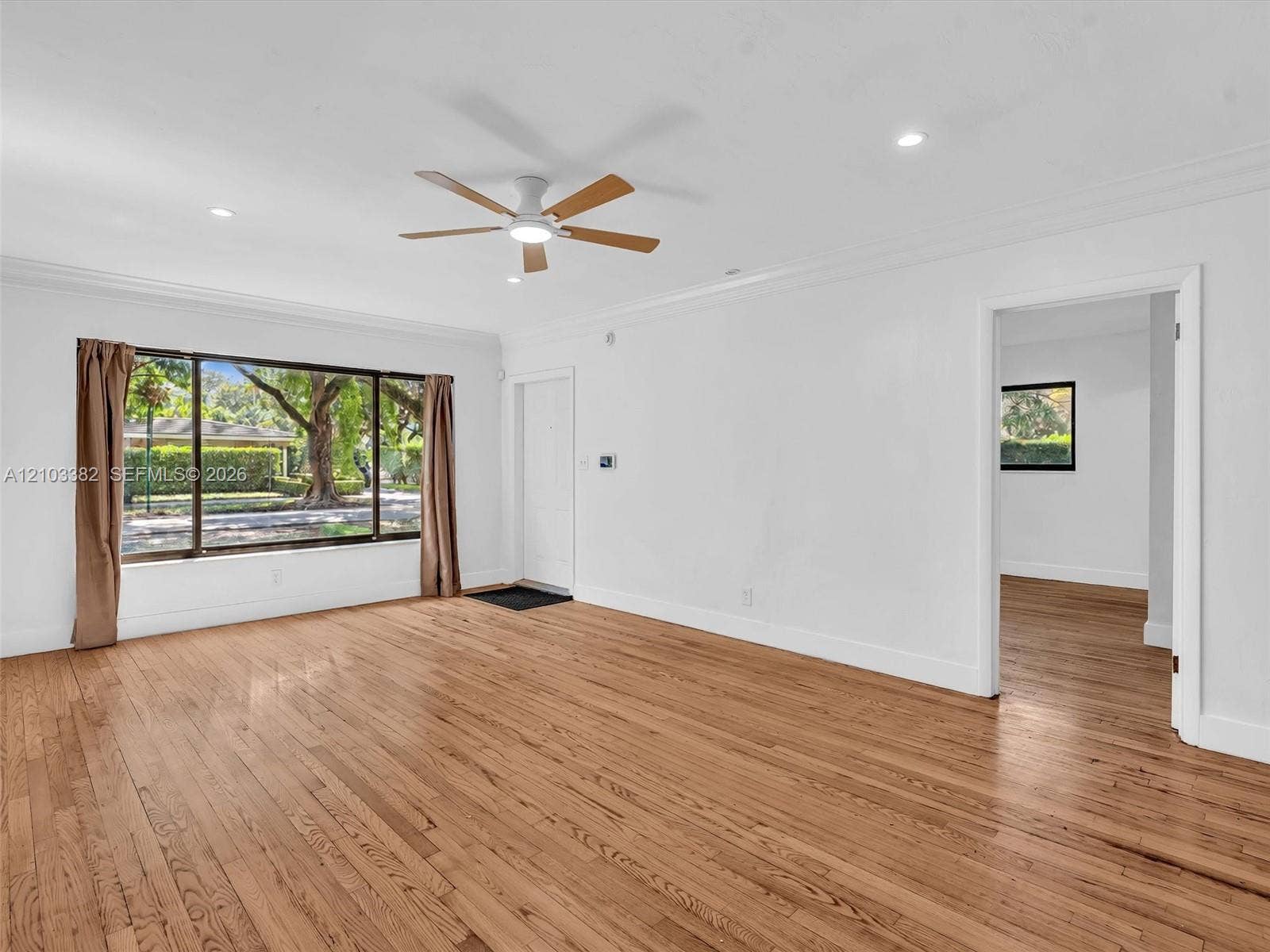 1545 Mantua Avenue, Coral Gables, Coral Gables, FL 33146 Living room view featuring wood-finish flooring, crown molding, recessed lighting, and a ceiling fan. House for rent in Coral Gables. House for rent listed by Realtor.
