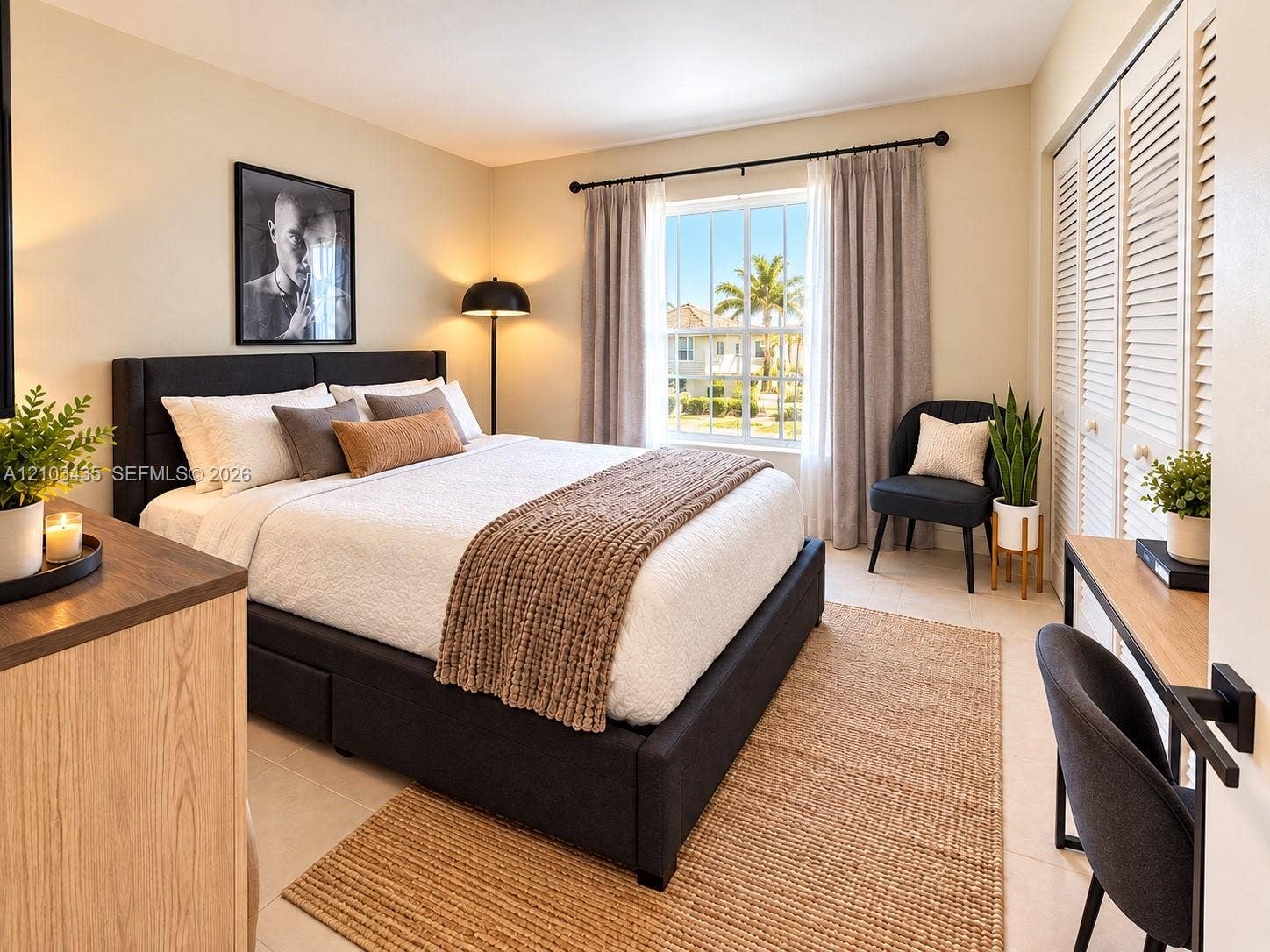 Miami, FL 33177 Bedroom featuring large window with muntins, neutral tile flooring, and dual bi-fold closet doors with louvered panels