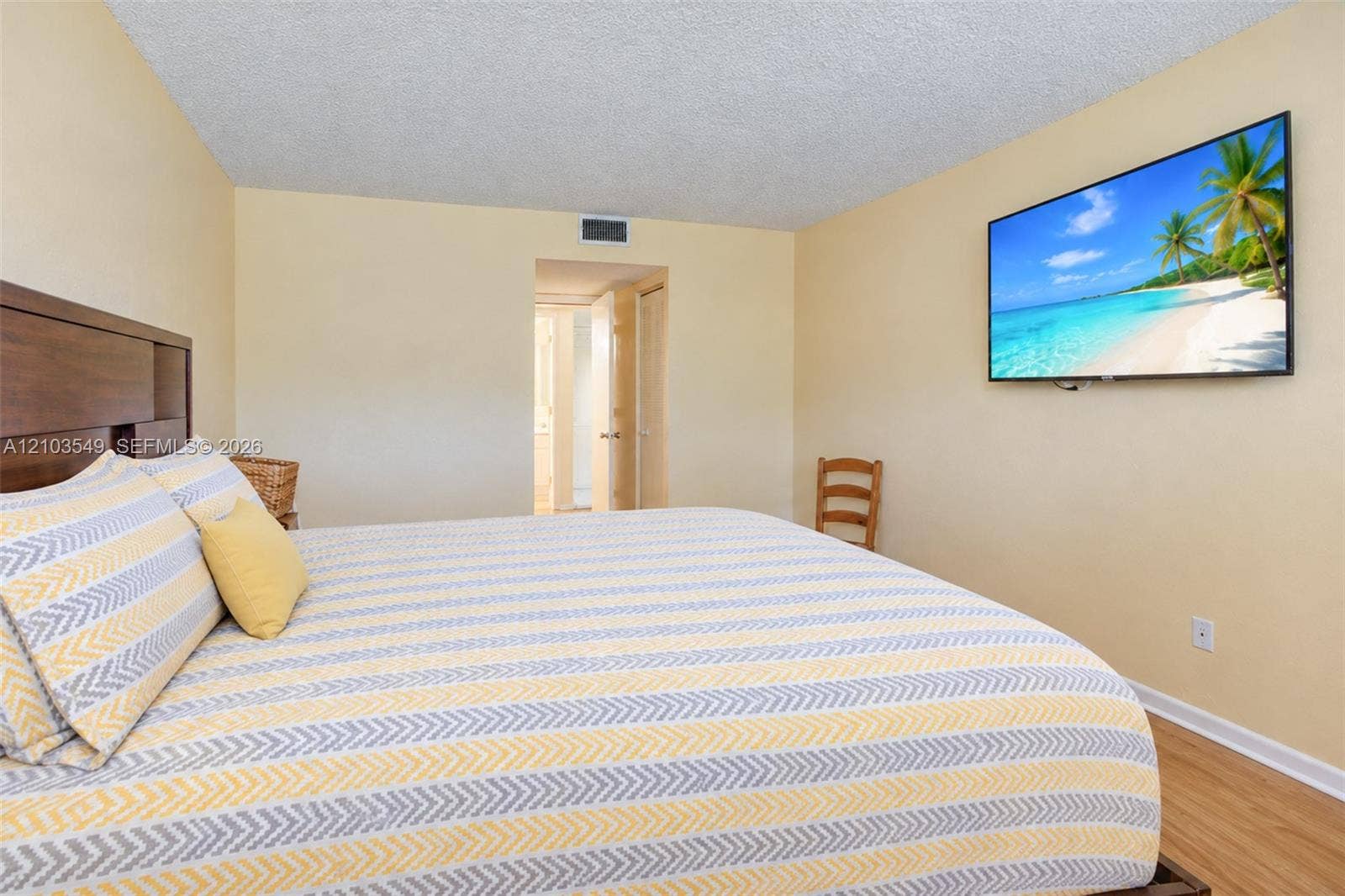8901 N New River Canal Road, #4W, Plantation, Plantation, FL 33324 Neutral wall-to-wall interior paint, wood-finish flooring, and recessed ceiling texture
