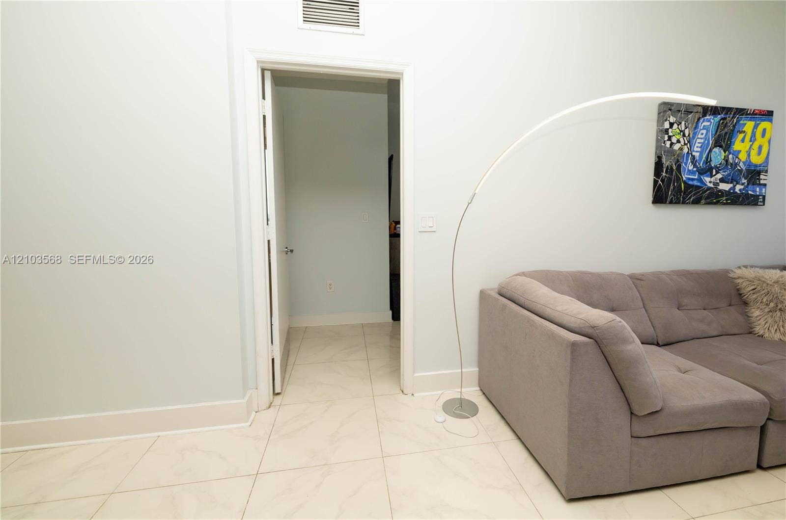 7901 Hispanola Avenue, #801, North Bay Village, FL 33141 Interior space featuring large-format light-toned tile flooring and neutral wall color