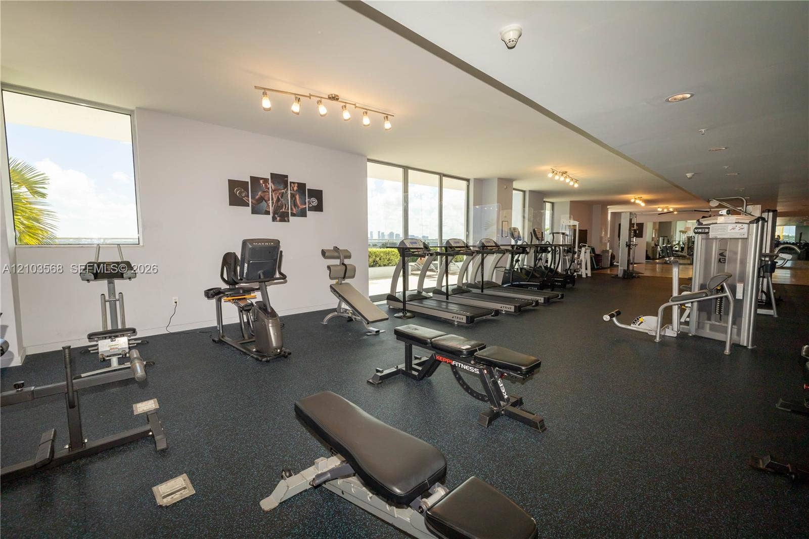 7901 Hispanola Avenue, #801, North Bay Village, FL 33141 Fitness center featuring rubberized flooring, expansive floor-to-ceiling windows, and track lighting