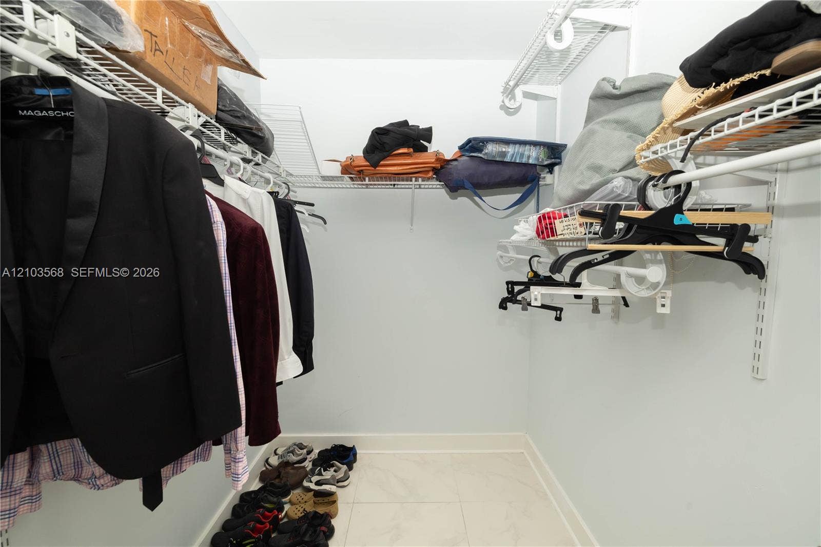7901 Hispanola Avenue, #801, North Bay Village, FL 33141 Walk-in closet featuring floor-to-ceiling white wire shelving and light-colored tile flooring