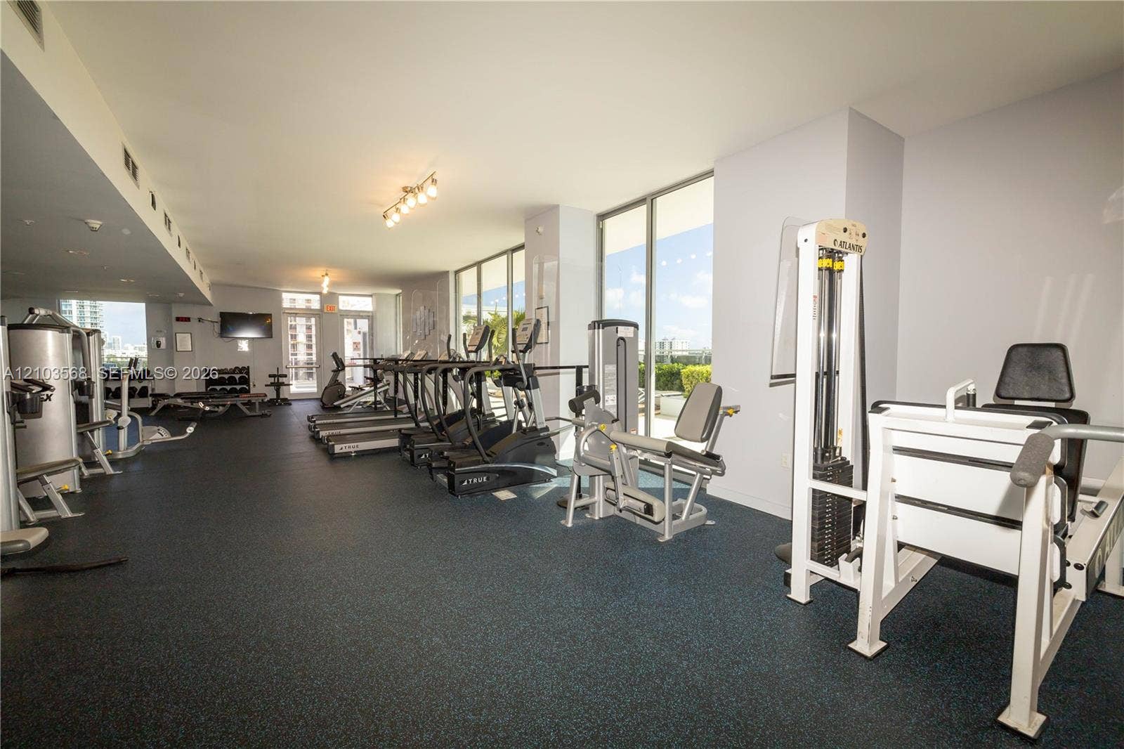7901 Hispanola Avenue, #801, North Bay Village, FL 33141 Fitness center featuring floor-to-ceiling windows, rubberized flooring, and recessed lighting