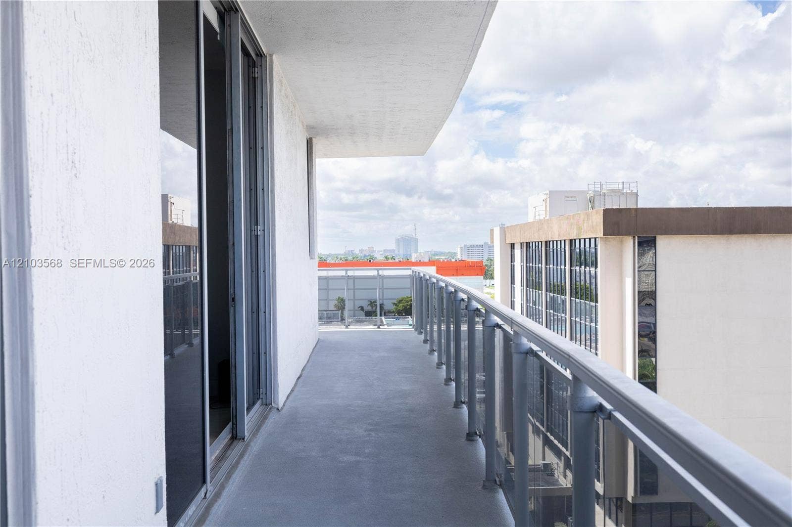 7901 Hispanola Avenue, #801, North Bay Village, FL 33141 Private balcony featuring concrete flooring and a metal railing with glass panels