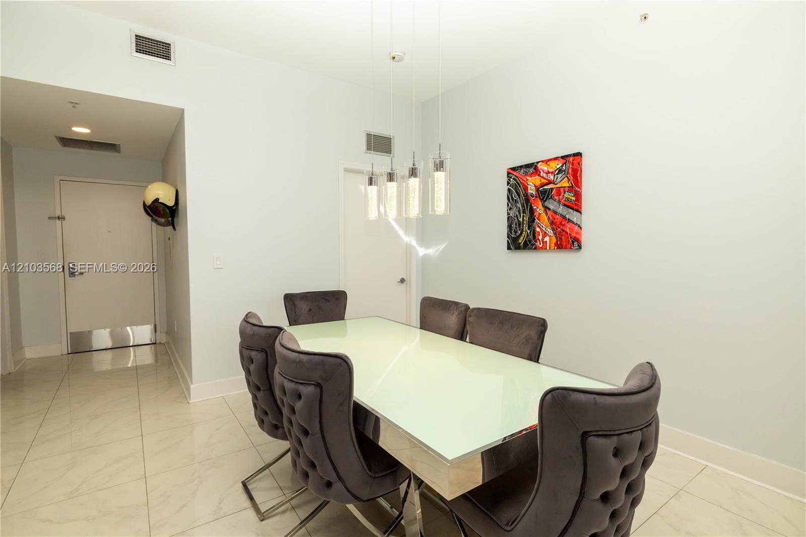 7901 Hispanola Avenue, #801, North Bay Village, FL 33141 Light-toned tile flooring, four-pendant glass light fixture, and neutral wall palette