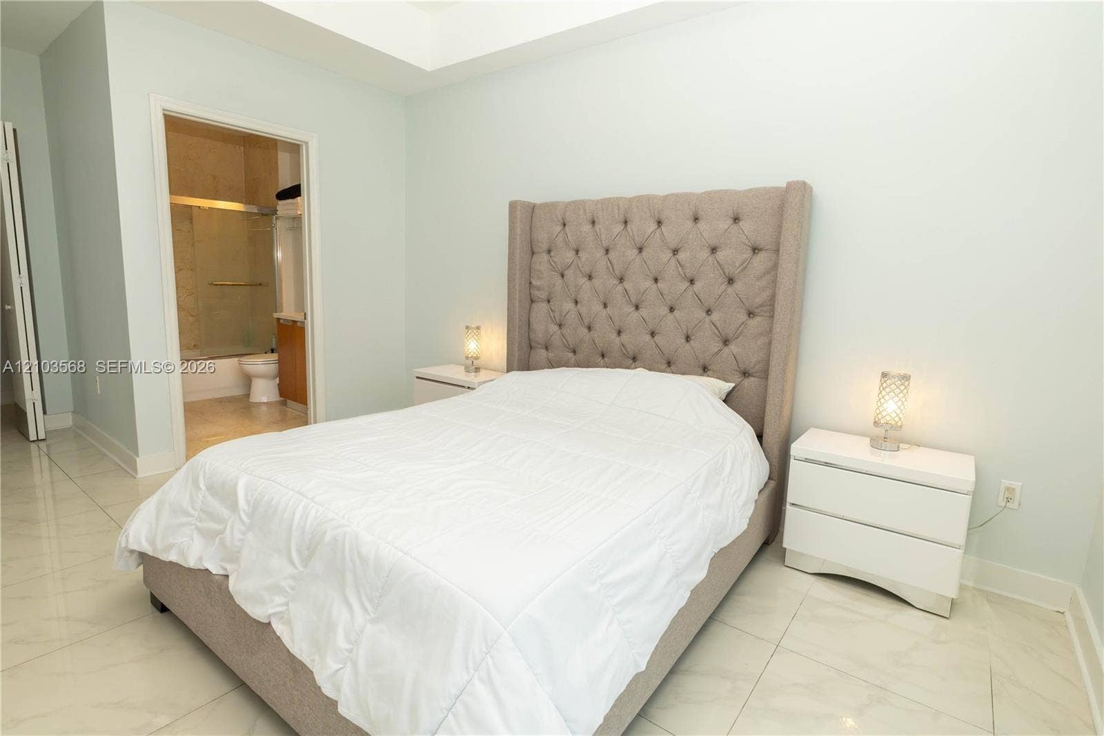 7901 Hispanola Avenue, #801, North Bay Village, FL 33141 Tray ceiling featuring large-format tile flooring