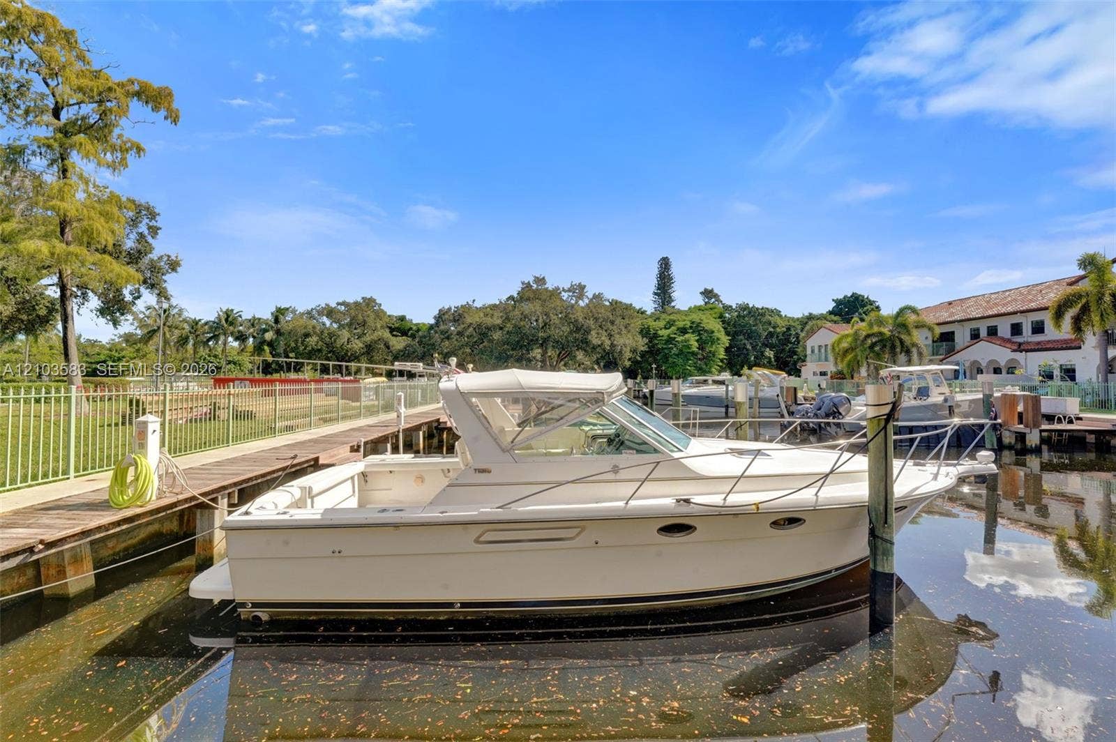 Private deep-water dock featuring metal piling and surrounding perimeter fencing