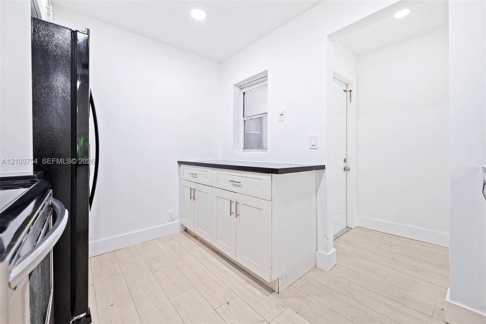 Extra cabinets and counter space with window