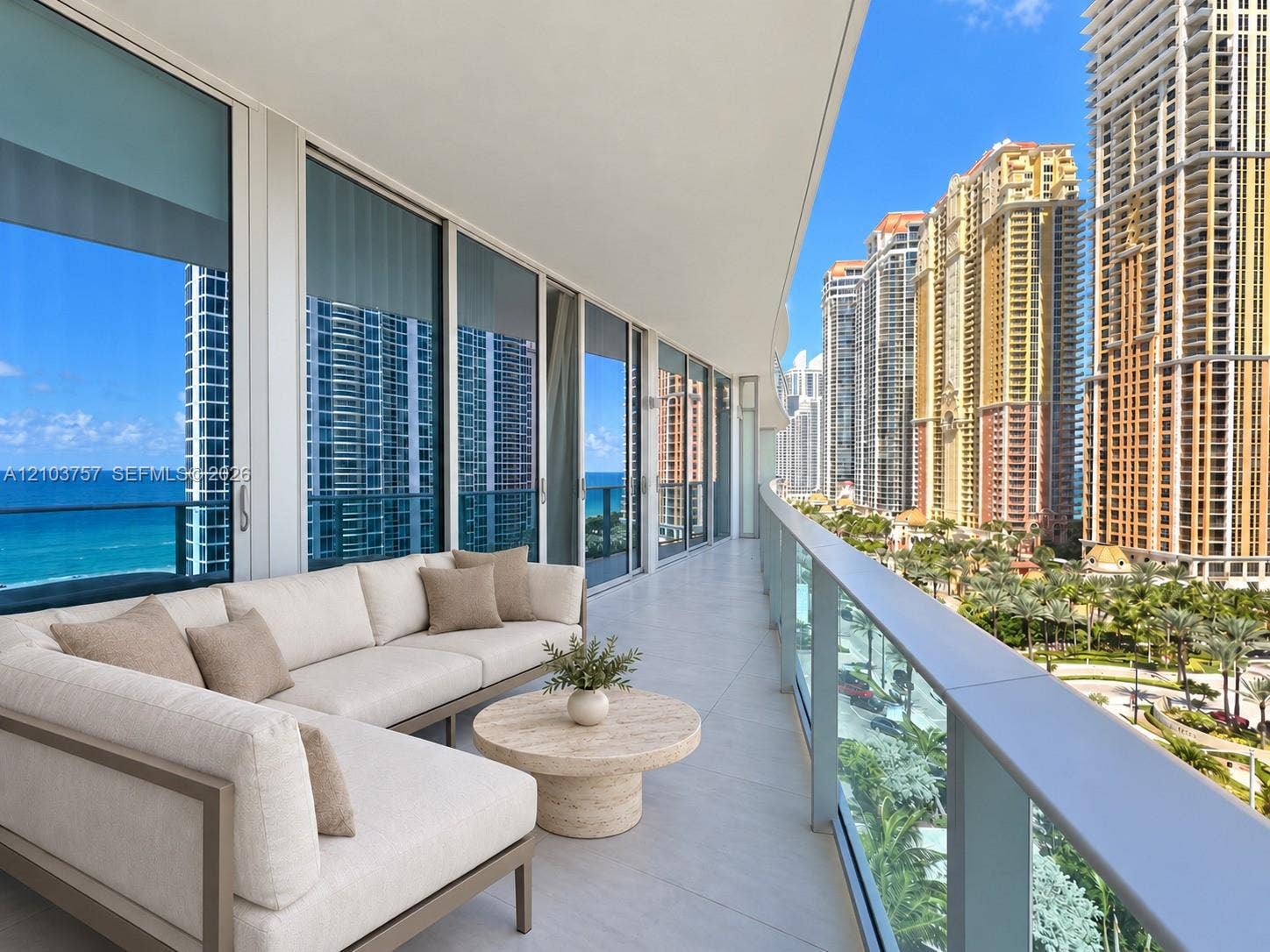 17550 Collins Avenue, #1103, Sunny Isles Beach, Sunny Isles Beach, FL 33160 Expansive balcony featuring floor-to-ceiling sliding glass doors, a glass railing, and tiled flooring