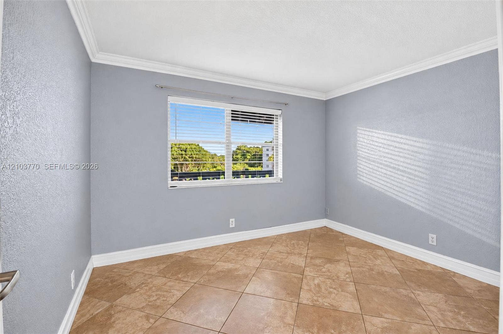 9440 SW 8th Street, #309, Boca Raton, Boca Raton, FL 33428 Window with horizontal blinds, crown molding, and tile flooring