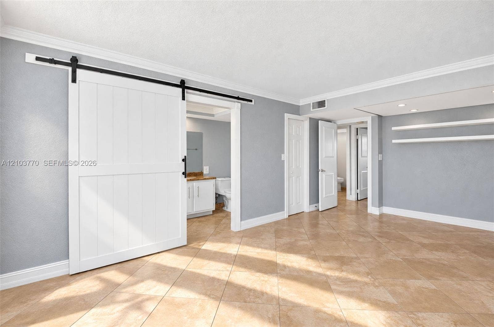 9440 SW 8th Street, #309, Boca Raton, Boca Raton, FL 33428 Wood-finish flooring with crown molding and white baseboards