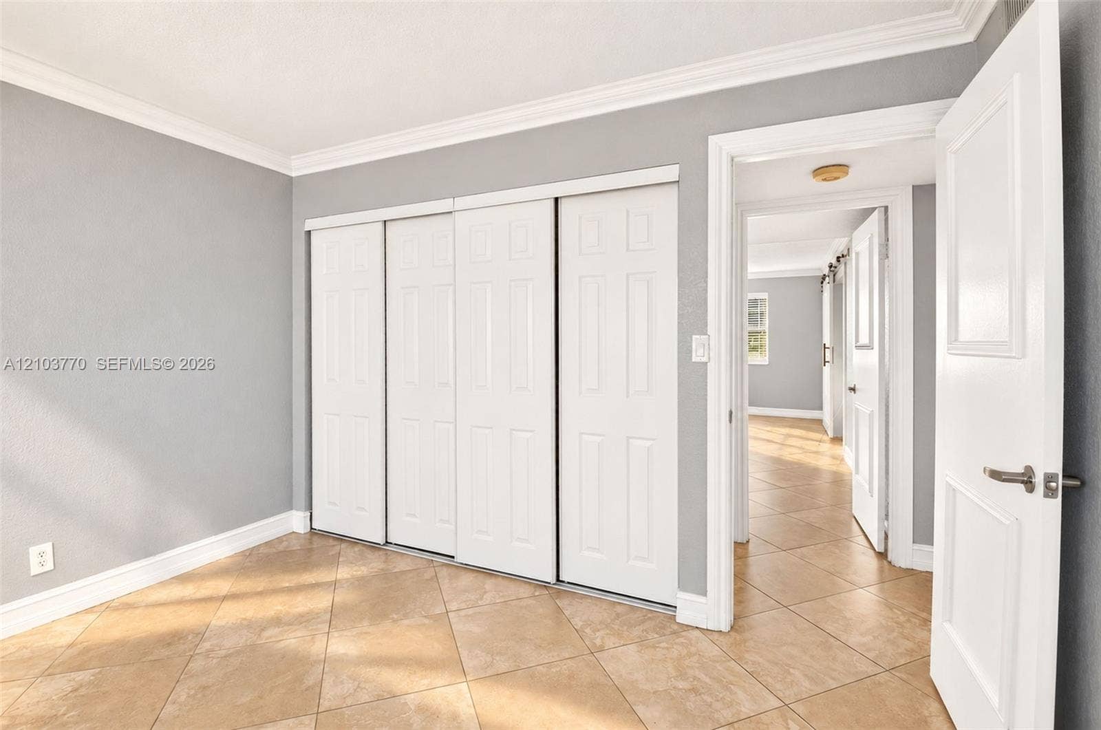 9440 SW 8th Street, #309, Boca Raton, Boca Raton, FL 33428 Neutral-toned tile flooring, light gray walls, and white crown molding