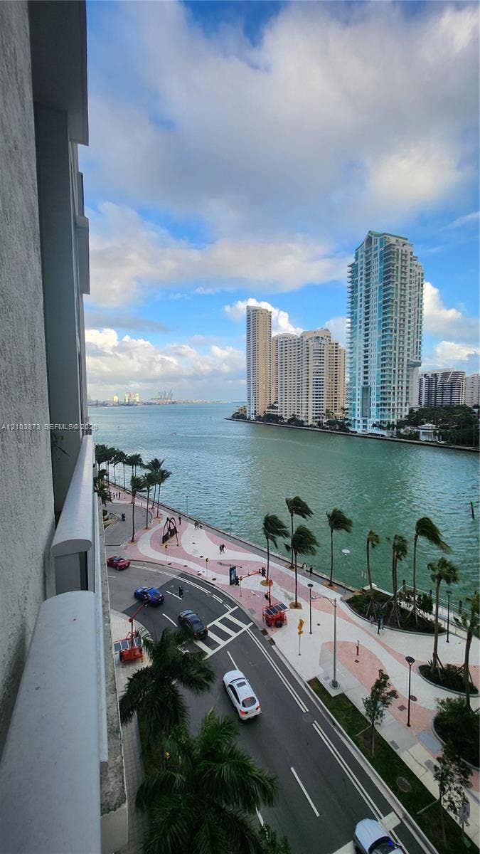 300 S Biscayne Boulevard, #L-808, Miami, FL 33131 Exterior balcony featuring a concrete railing with unobstructed water, city skyline, and waterfront promenade surroundings