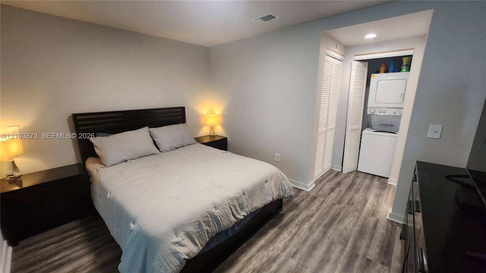 300 S Biscayne Boulevard, #L-808, Miami, FL 33131 Wood-finish flooring, recessed ceiling lighting, and double-door louvered closet housing a built-in stackable washer and dryer unit