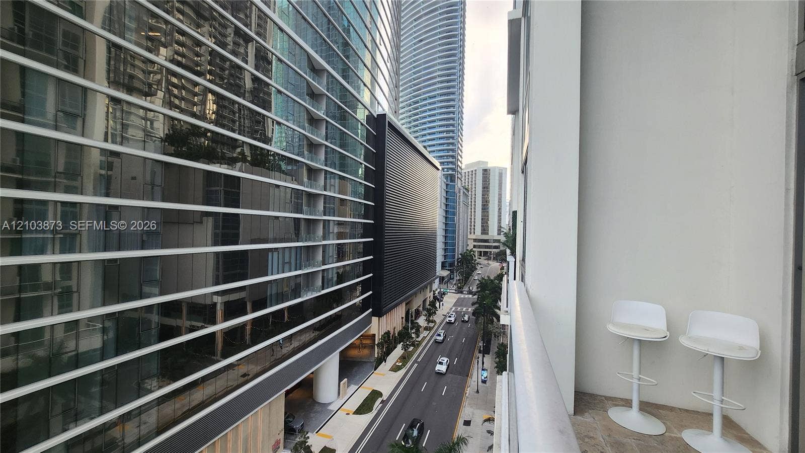 300 S Biscayne Boulevard, #L-808, Miami, FL 33131 Covered balcony featuring stone-finish flooring and a metal railing
