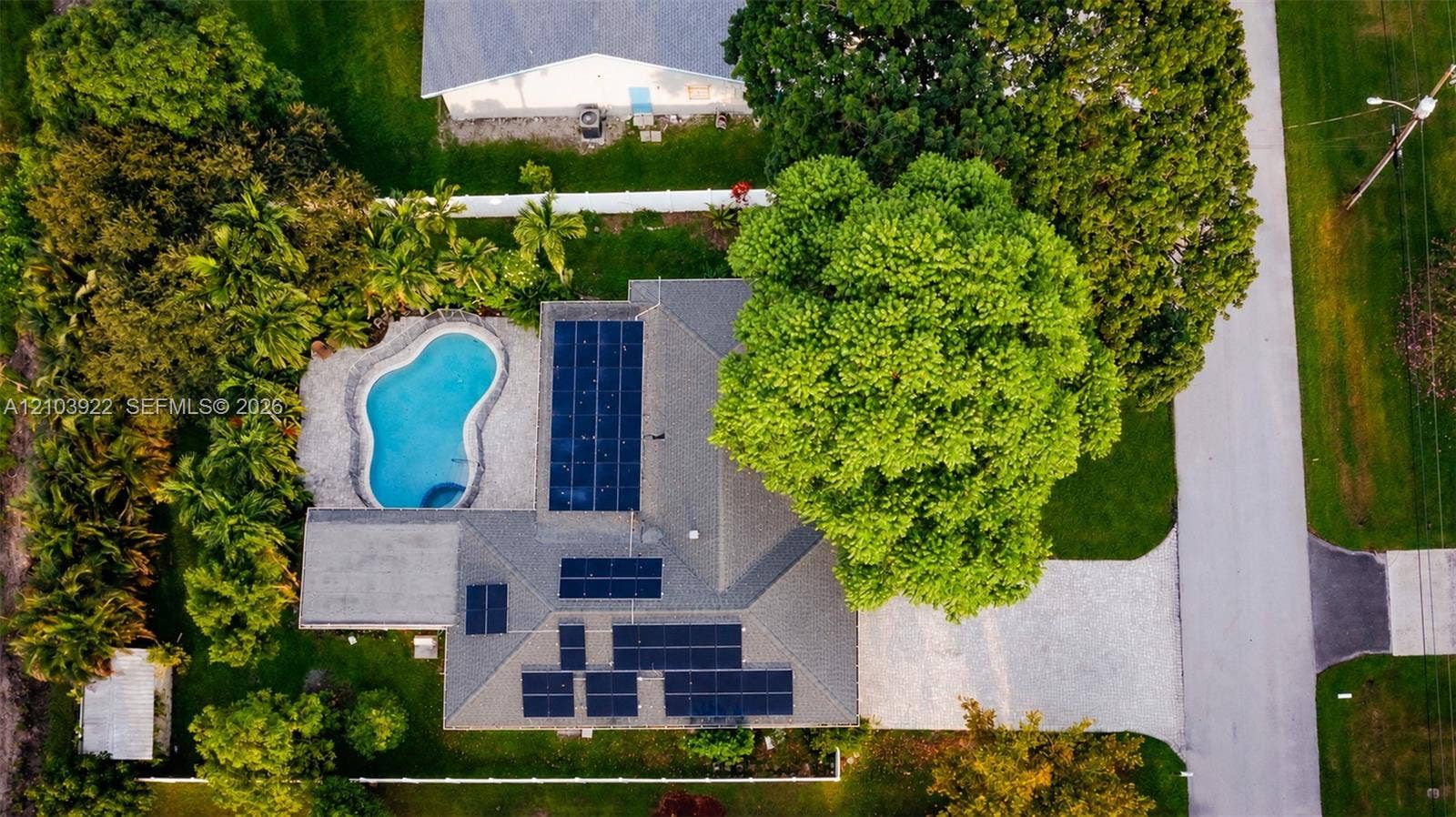 Private swimming pool with surrounding hardscaping