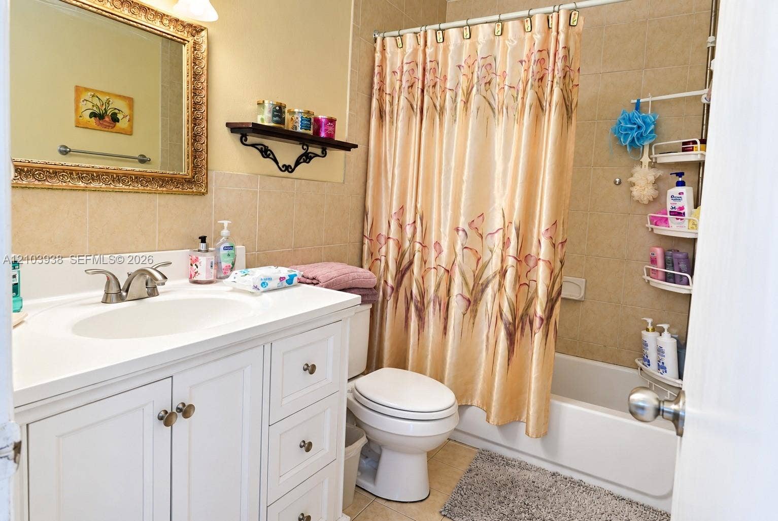 11335 SW 71st Lane, Miami, FL 33173 Bathroom featuring white cabinetry, an integrated sink with a dual-handle faucet, ceramic tile wall surround, and a tub-shower combination