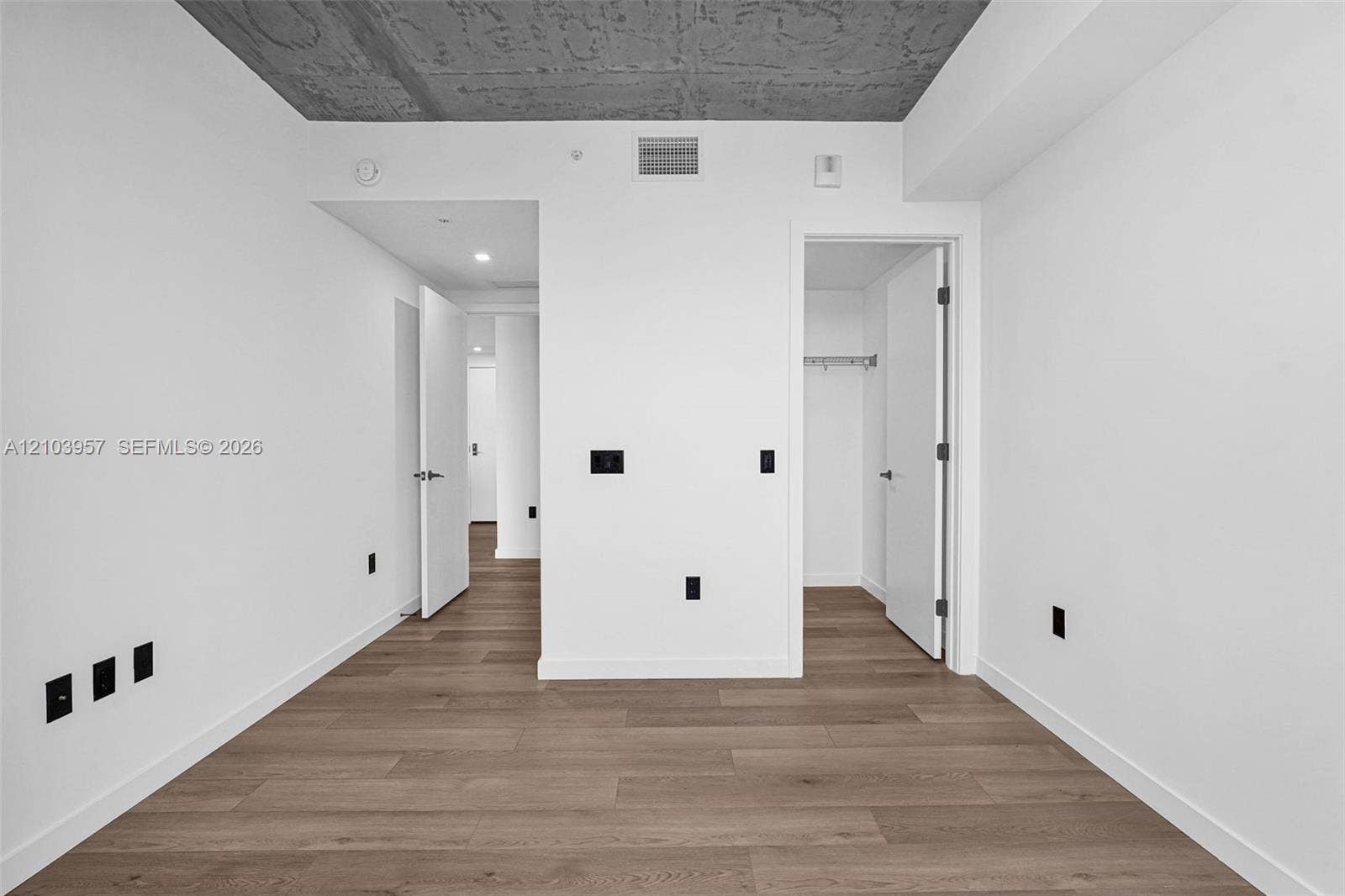 307 SW 5th Street, #0, Fort Lauderdale, Fort Lauderdale, FL 33315 Wood-finish flooring with white baseboards and neutral white walls