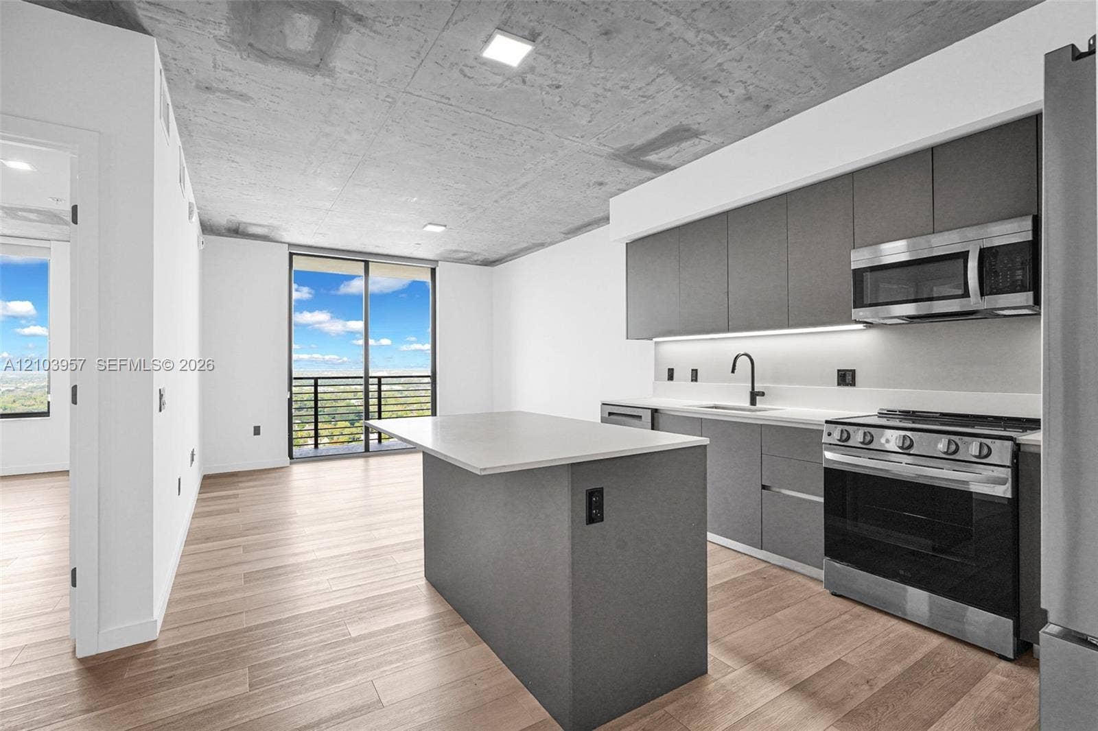 307 SW 5th Street, #0, Fort Lauderdale, Fort Lauderdale, FL 33315 Modern kitchen featuring stainless steel appliances, matte gray cabinetry, and light-toned countertops