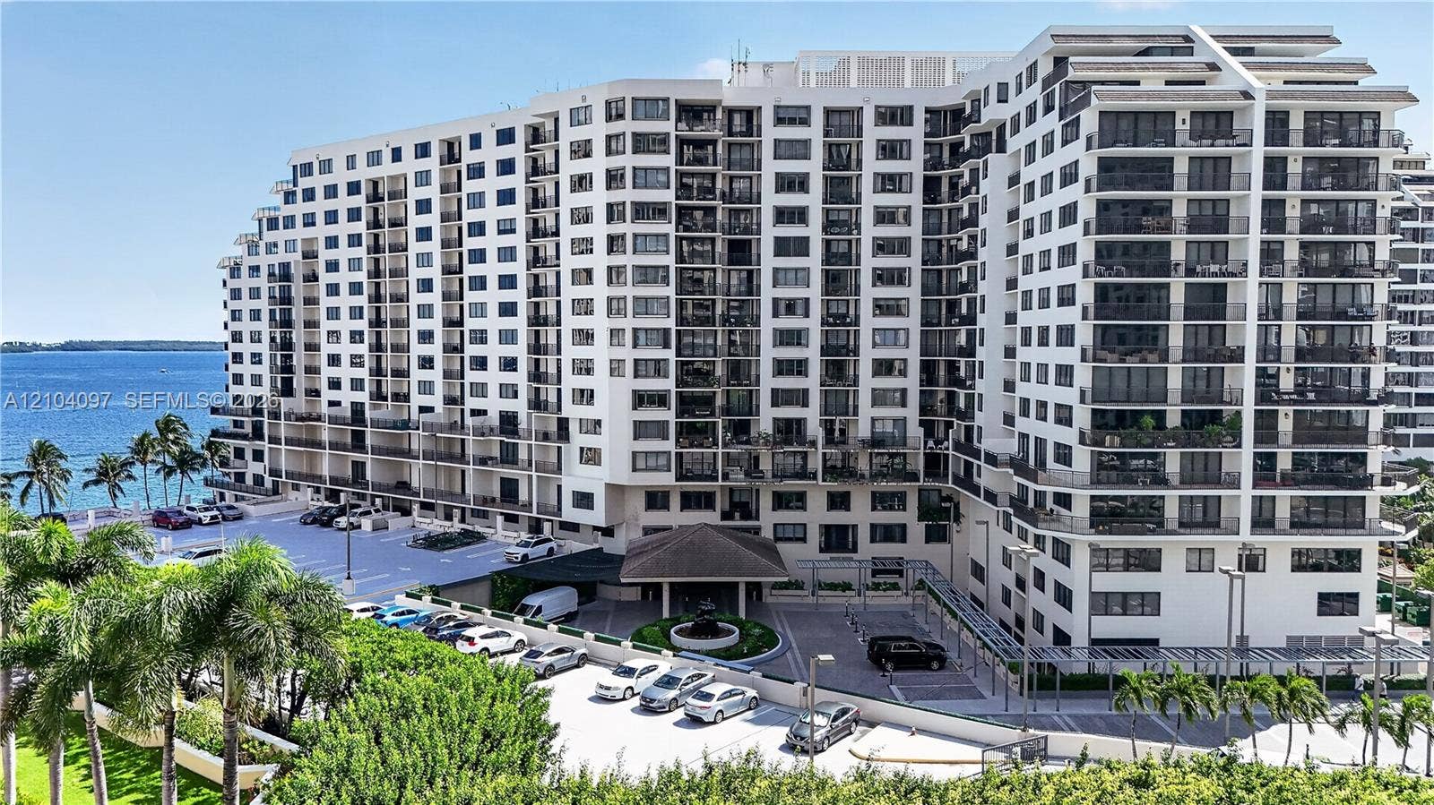 540 Brickell Key Drive, #916, Miami, Miami, FL 33131 High-rise residential exterior featuring private balconies, integrated parking, a structured entry portico, and proximity to the waterfront