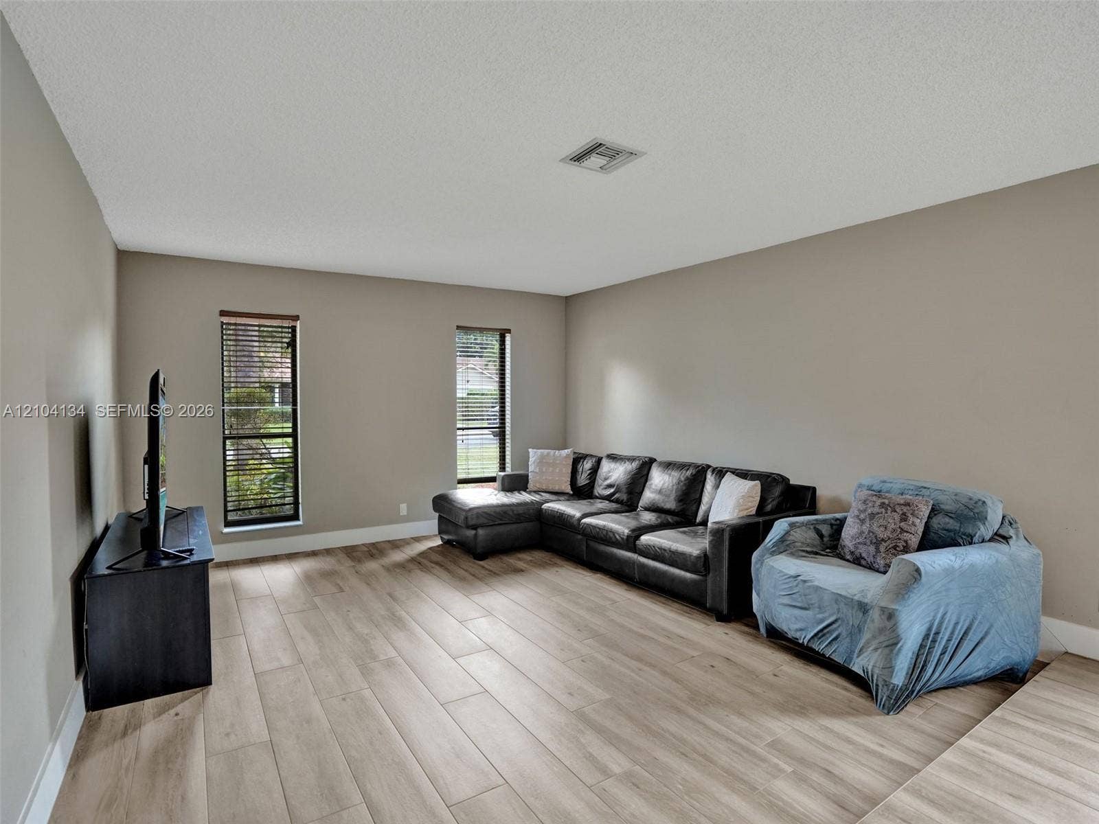 Spacious sunken Living room with lots of light!
