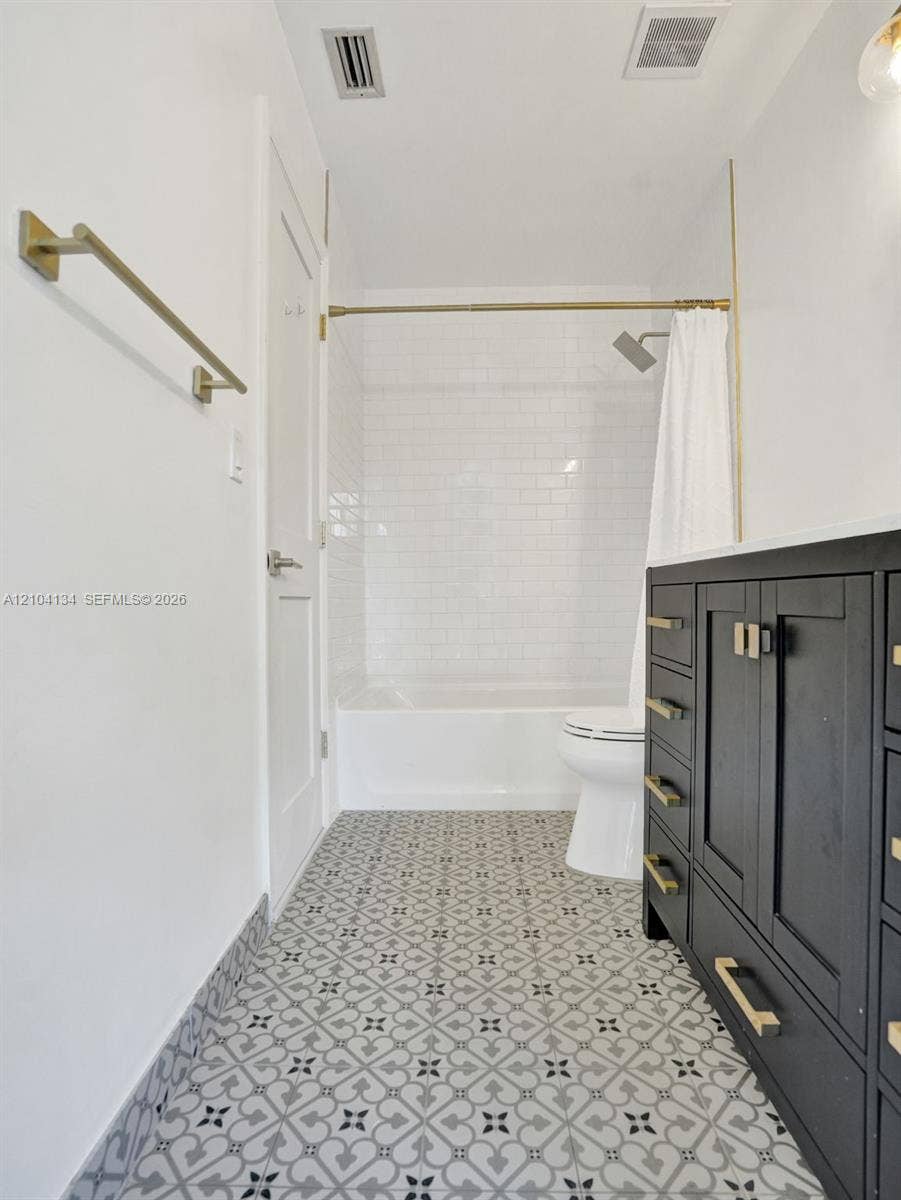 Custom Tiles in the cabana Bath & Subway tiles around the tub!