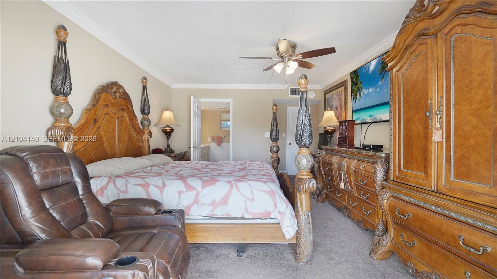 111 N Pompano Beach Boulevard, #304, Pompano Beach, FL 33062 Spacious room featuring neutral wall color, crown molding, and a multi-blade ceiling fan with integrated lighting