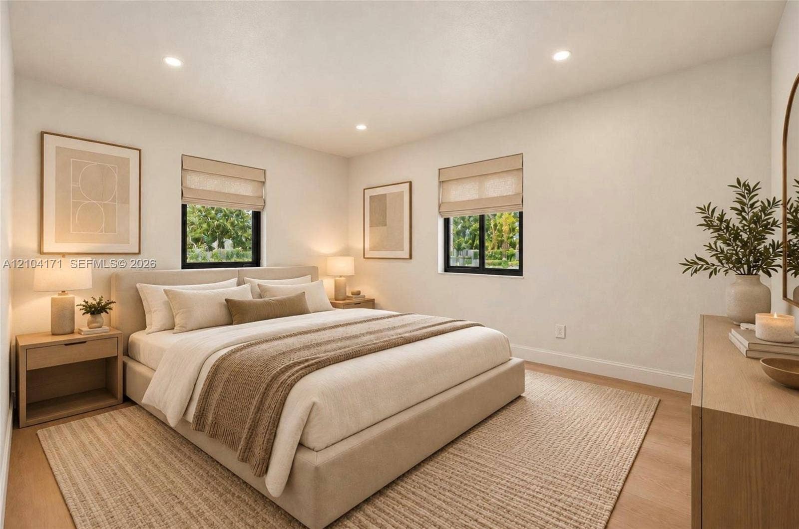 745 NW 32nd Avenue, Miami, FL 33125 Neutral-toned room featuring recessed ceiling lighting, light wood-finish flooring, and black-framed windows