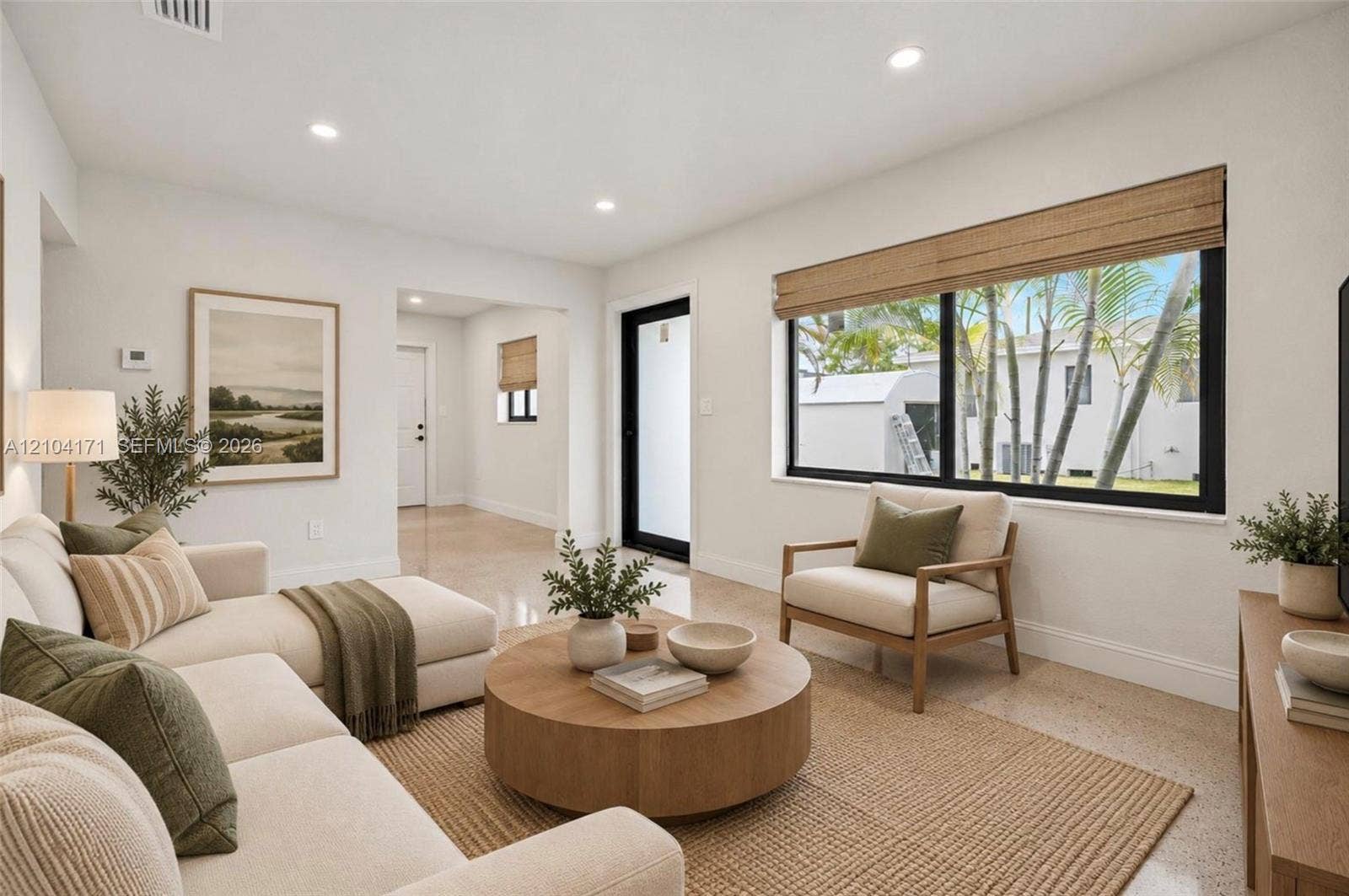 745 NW 32nd Avenue, Miami, FL 33125 Neutral-toned interior featuring terrazzo flooring, recessed lighting, and large picture windows framed in black