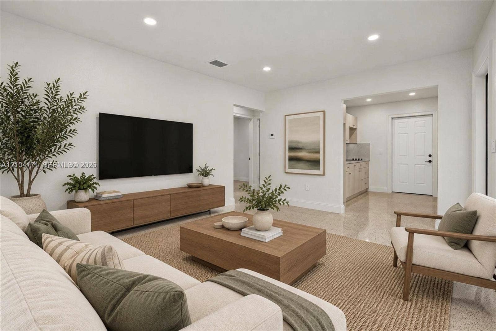 745 NW 32nd Avenue, Miami, FL 33125 Open floor plan featuring recessed lighting, smooth-finish wall surfaces, polished stone flooring, and a multi-panel door