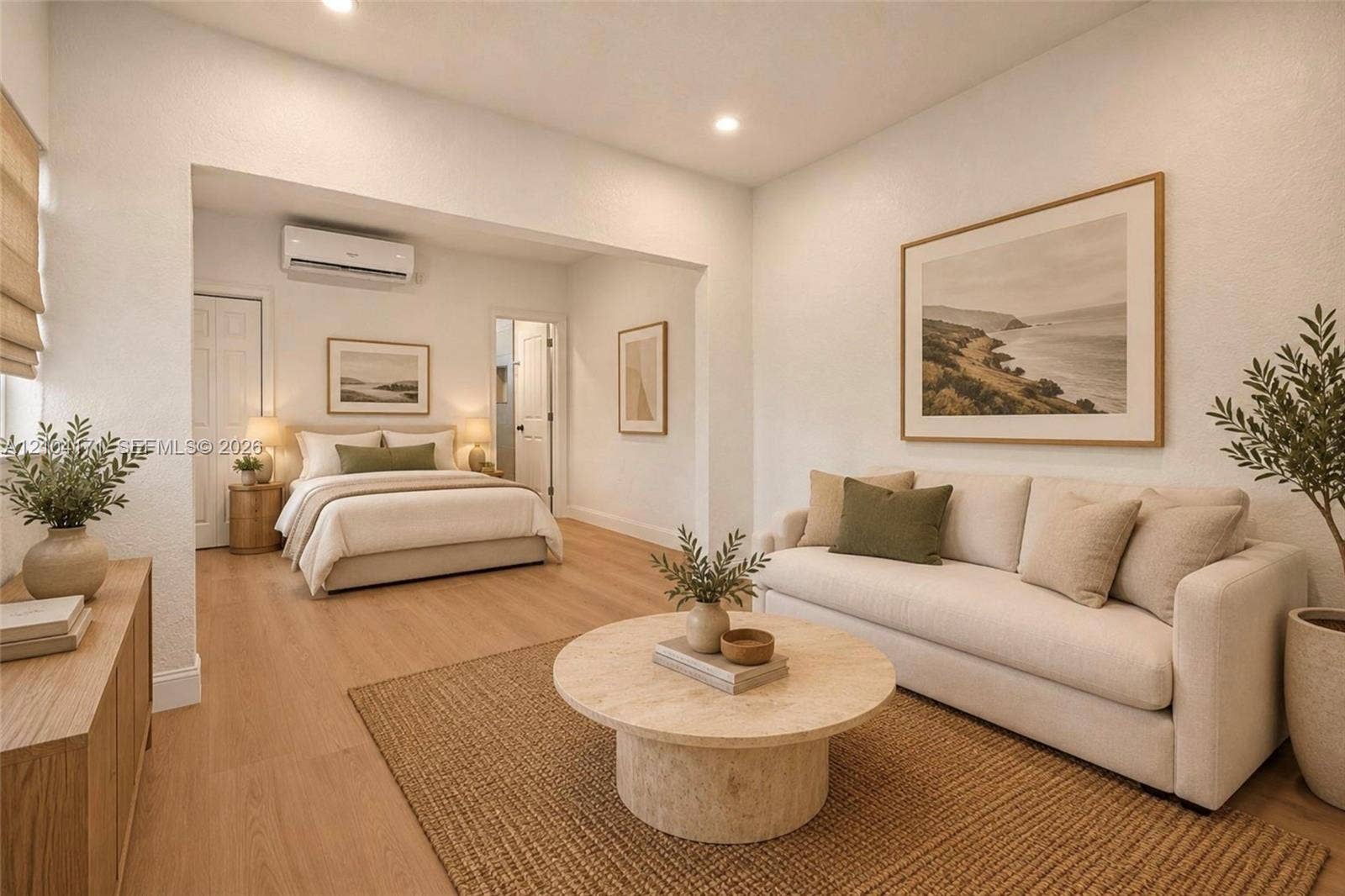 745 NW 32nd Avenue, Miami, FL 33125 Open-concept living space featuring wood-finish flooring, recessed lighting, and a wall-mounted ductless air conditioning unit