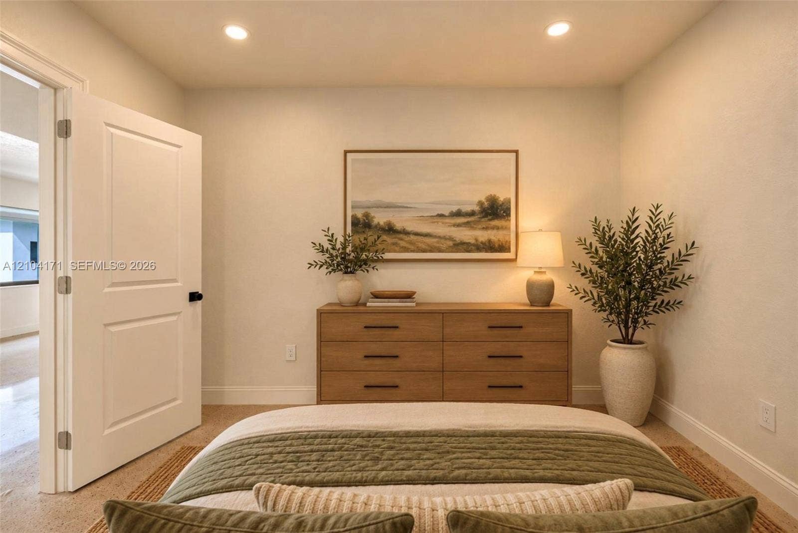745 NW 32nd Avenue, Miami, FL 33125 Neutral interior room featuring recessed ceiling lighting, a solid-core panel door, and light-toned wall finishes