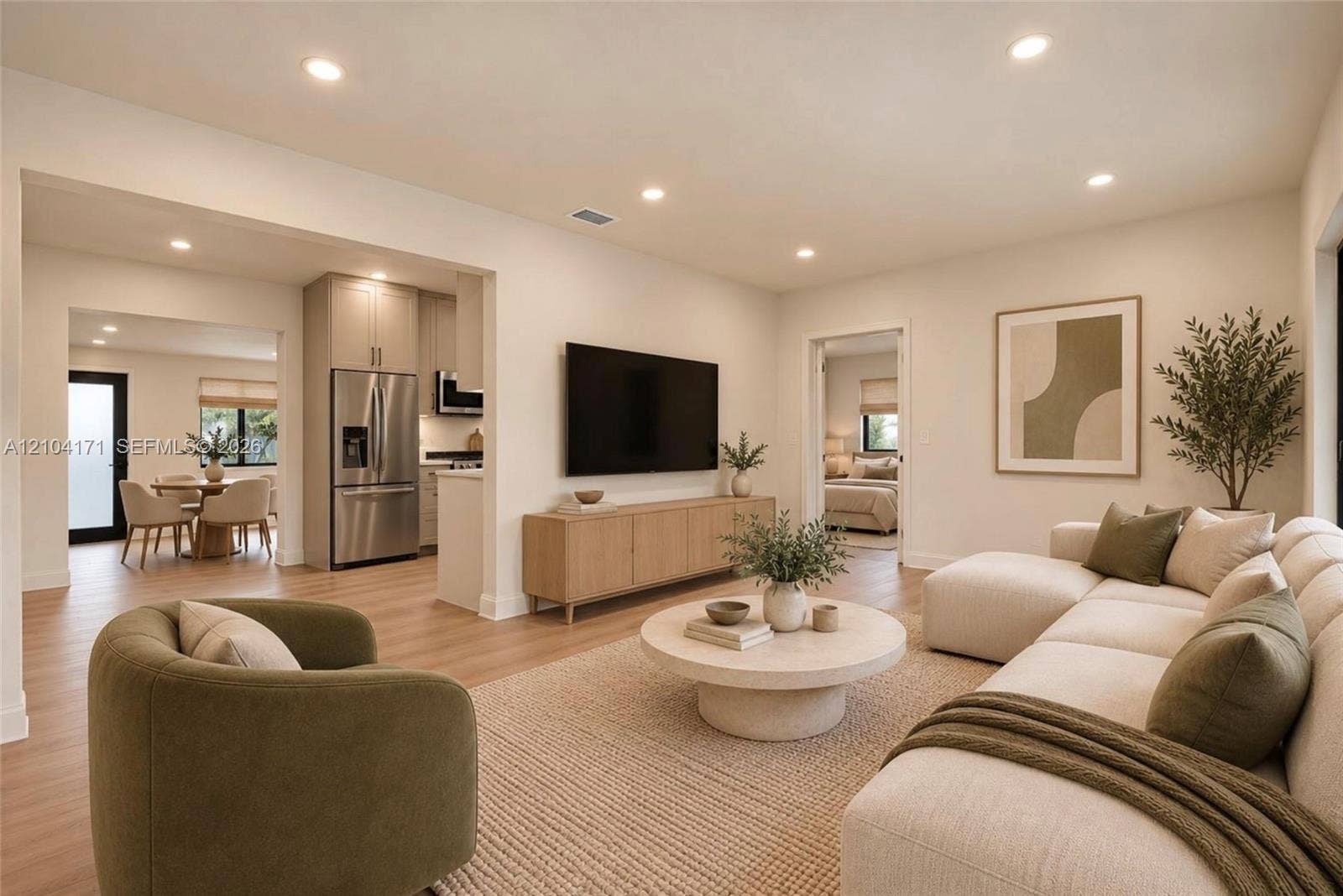745 NW 32nd Avenue, Miami, FL 33125 Open-concept living space featuring wood-finish flooring, recessed lighting, and stainless steel kitchen appliances