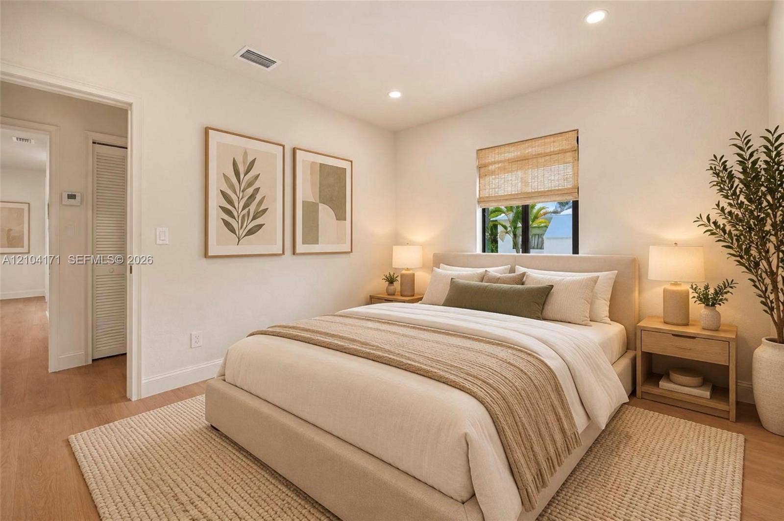 745 NW 32nd Avenue, Miami, FL 33125 Neutral-toned interior featuring wood-finish flooring, recessed lighting, and a window with a woven shade